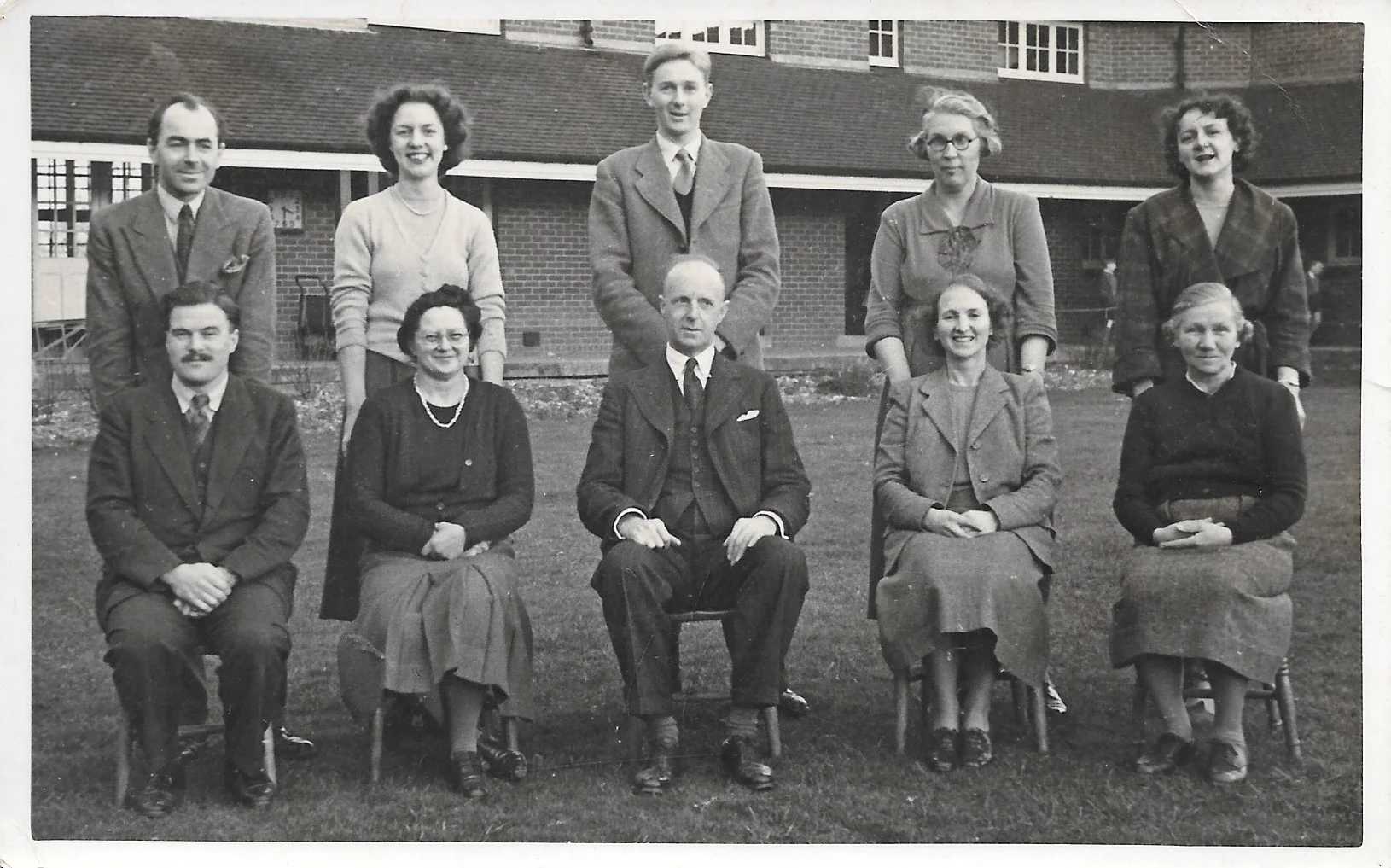 Mr King in the centre with Miss Glover second from the right in the back row.