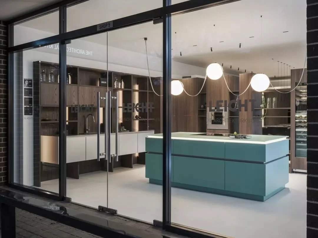 The window display at Leicht HQ is intended to turn heads,&nbsp;a bold contrast of dark timber veneer, brushed stainless steel &amp; floating aluminium cabinetry contrasted with a pop of colour.&nbsp;

Anchoring the composition (&amp; the attention) 