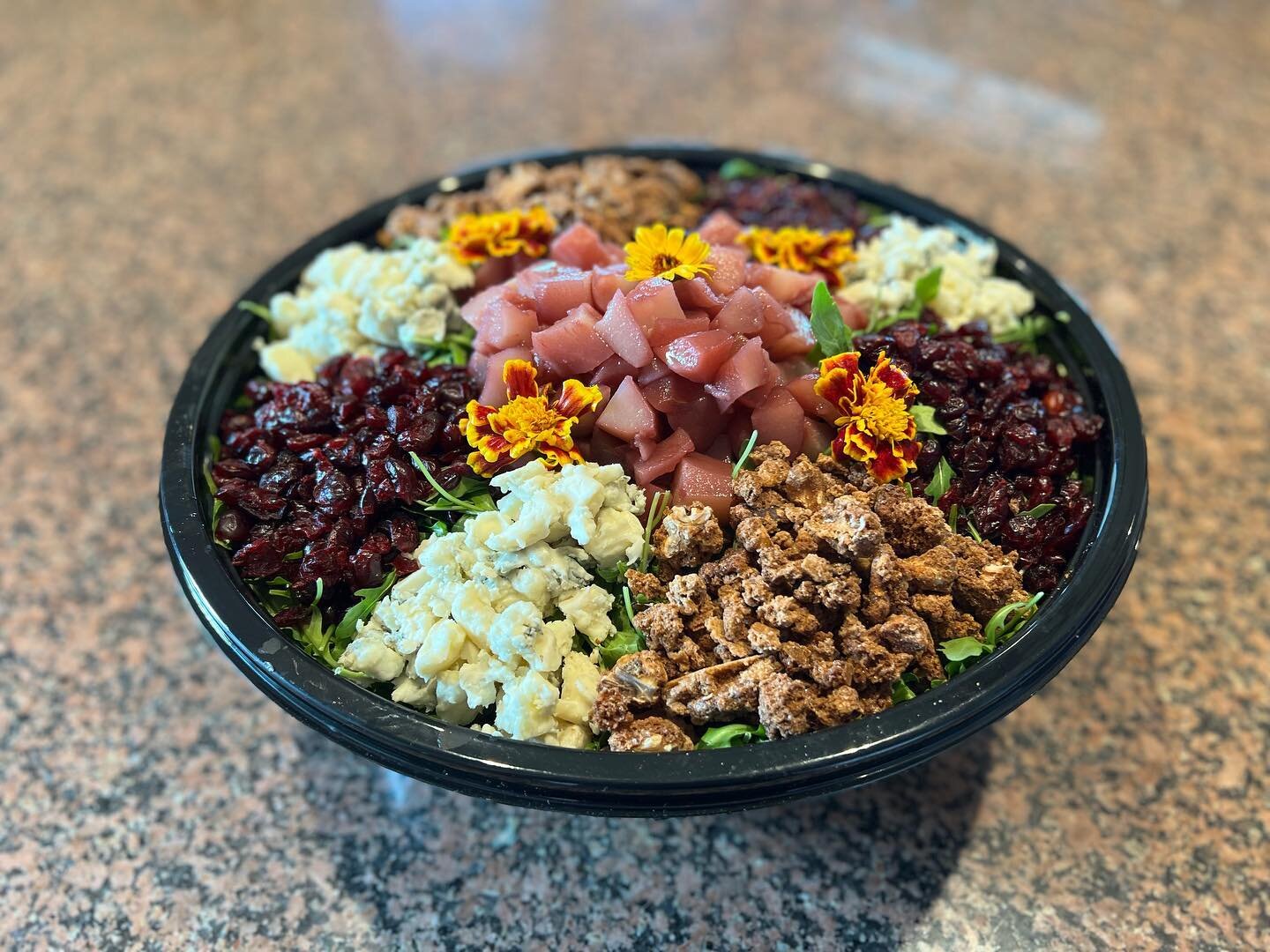 Poached Pear Salad for a catering order!

Poached pears
Arugula
Blue Cheese 
Dried Cranberries
Walnut Clusters
Maple Sherry Vinaigrette