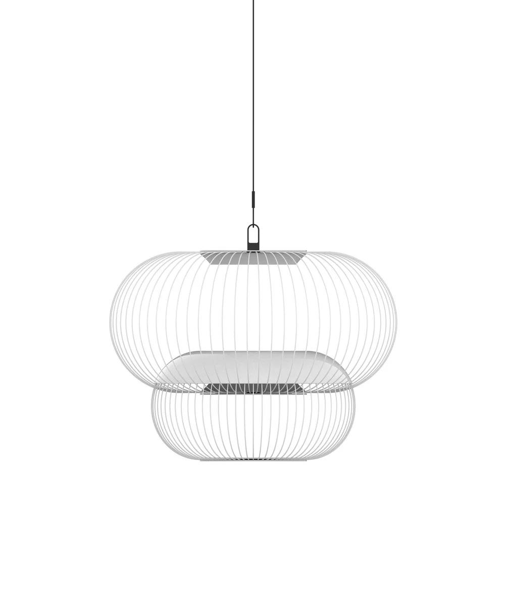  Its layered wireframe silhouette acts like a woven screen suspended in air — filtering brightness into delicate bands, shadows, and gradients that shift throughout the day. The result is a quiet tension between concealment and revelation. 