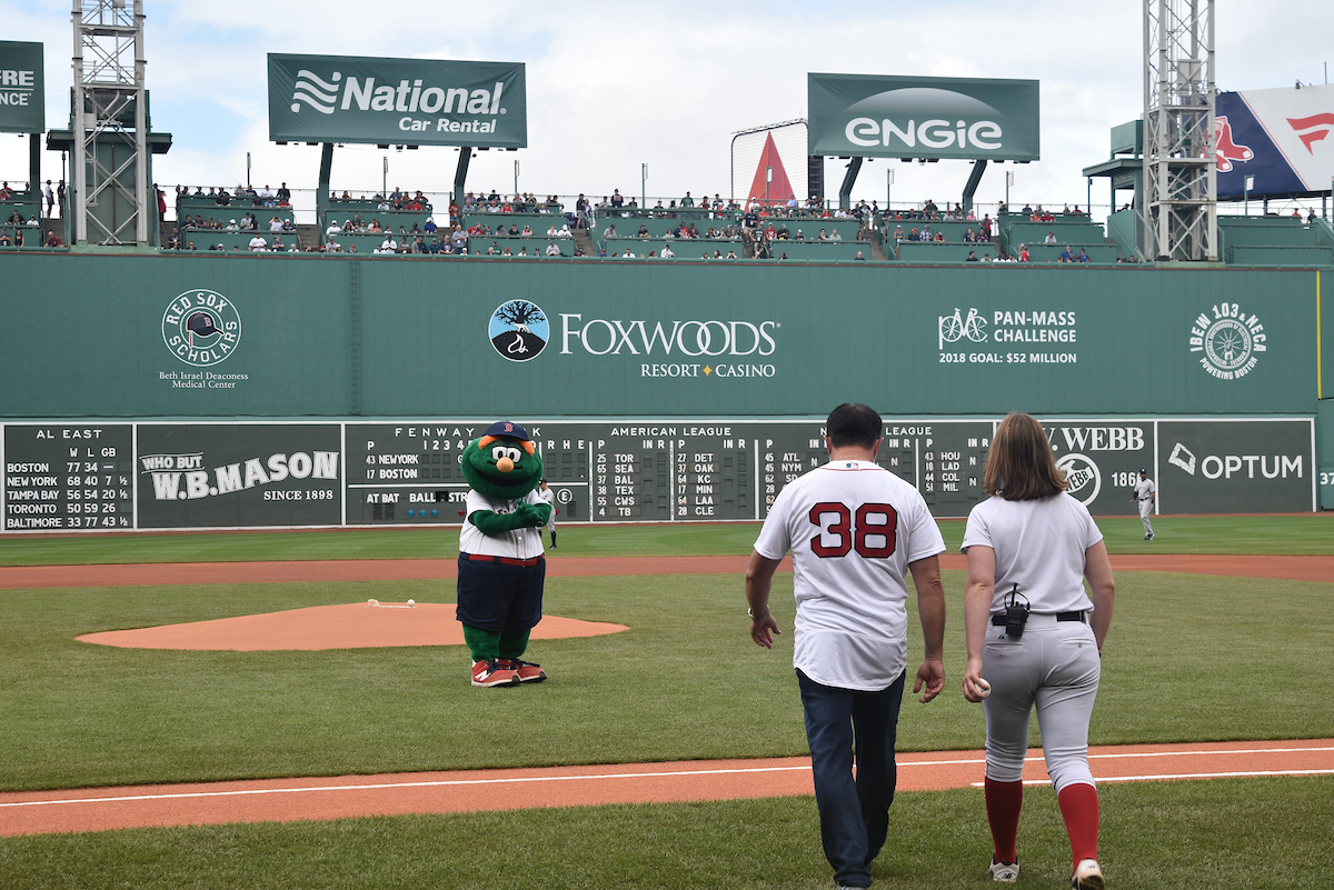 Howard is escorted to the pitchers mound in historic Fenway Park