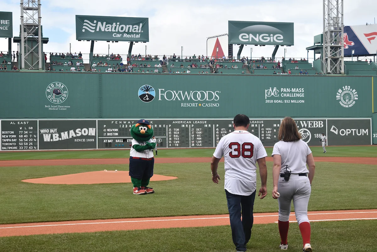 Howard is escorted to the pitchers mound in historic Fenway Park
