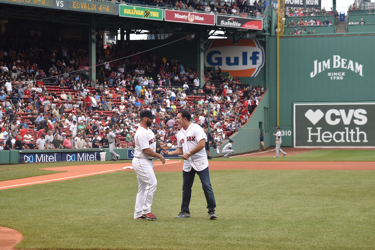 Howard receives commemorative baseball from Red Sox catcher, Dan Butler