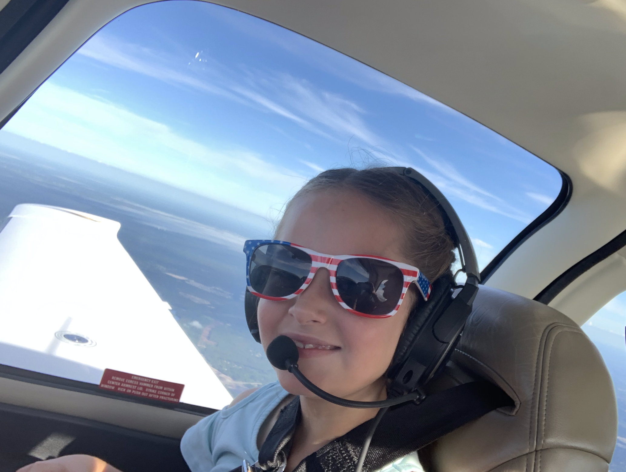 Flying the friendly skies with my granddaughter, Emma