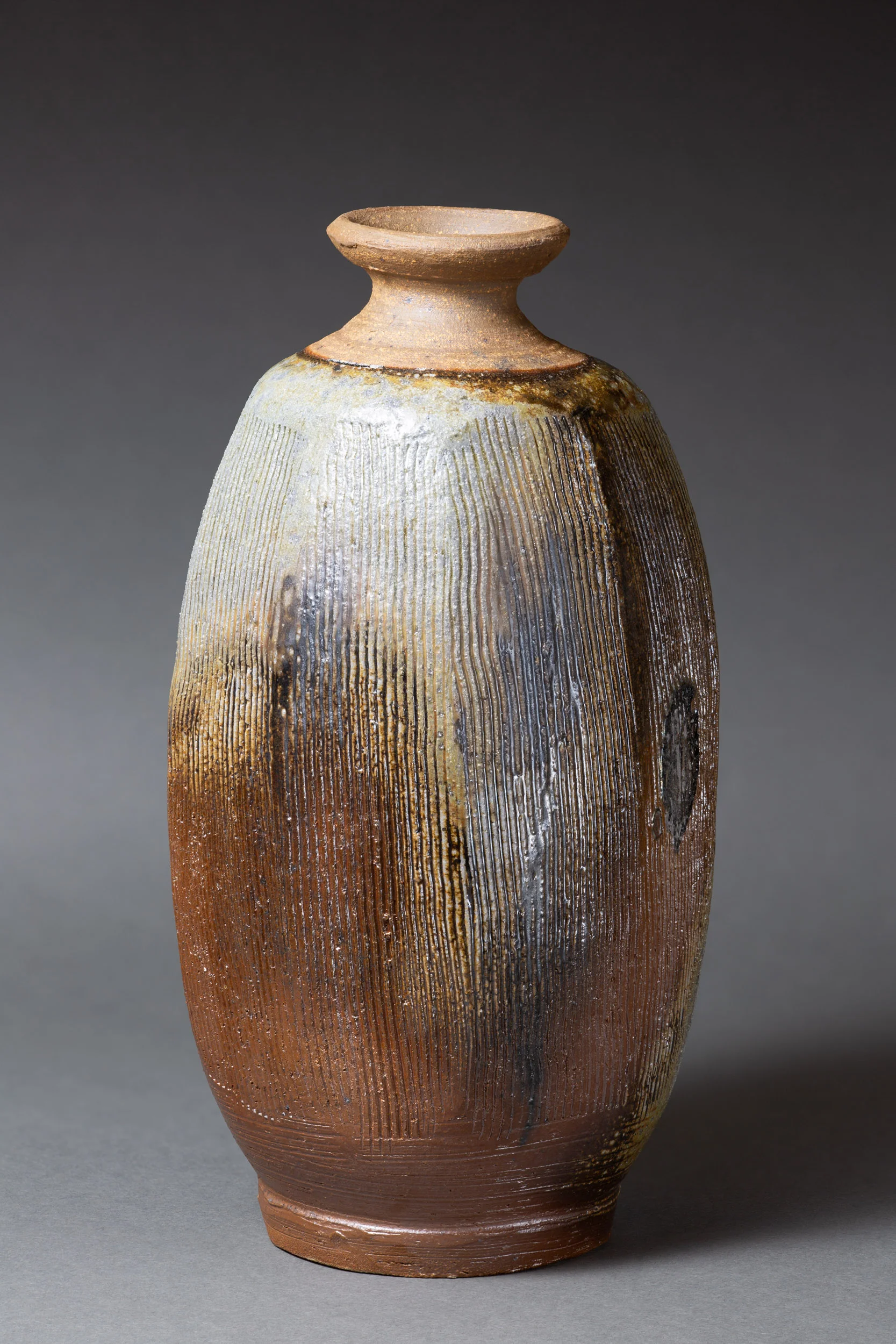   Octagonal bottle with comb marks   4.5” d, 8.75” h  ID: 6003   