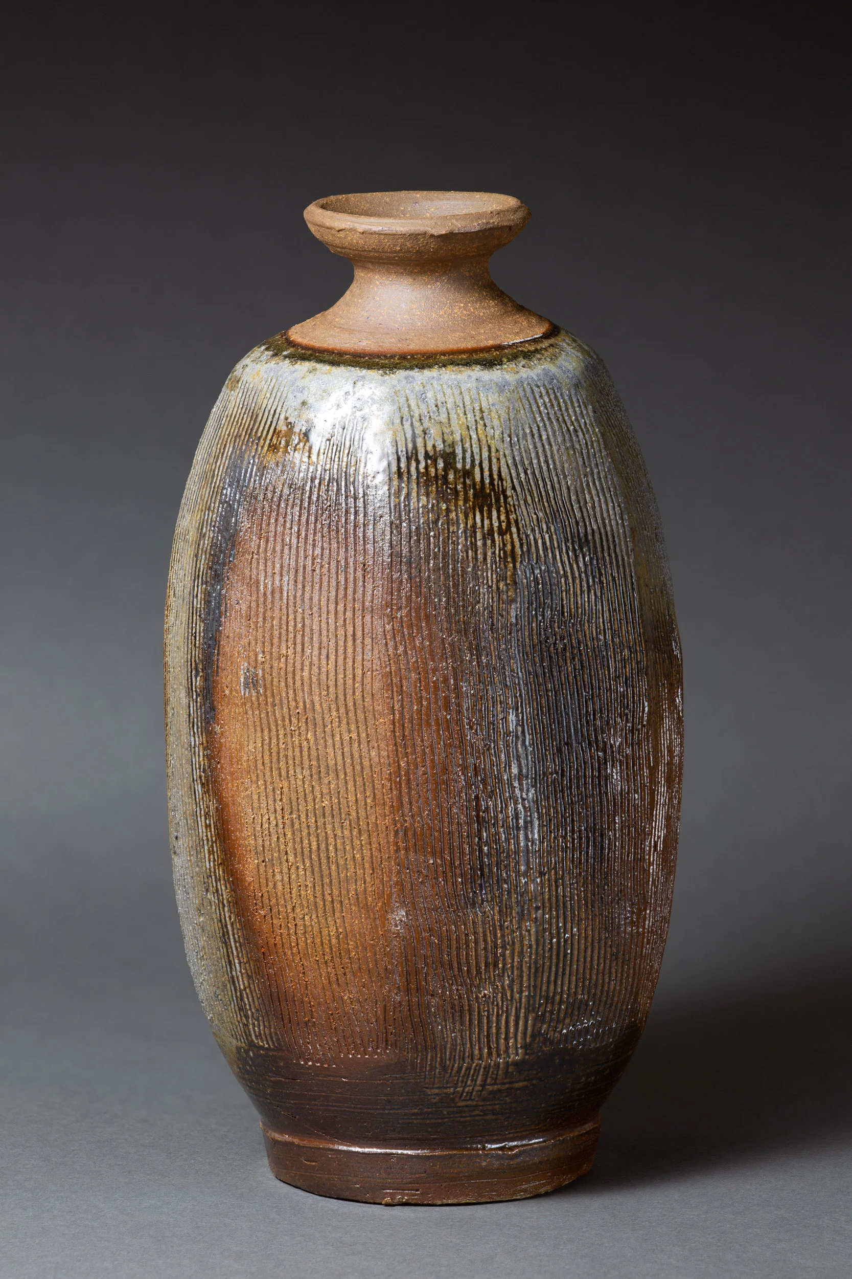   Octagonal bottle with comb marks   4.5” d, 8.75” h  ID: 6003   