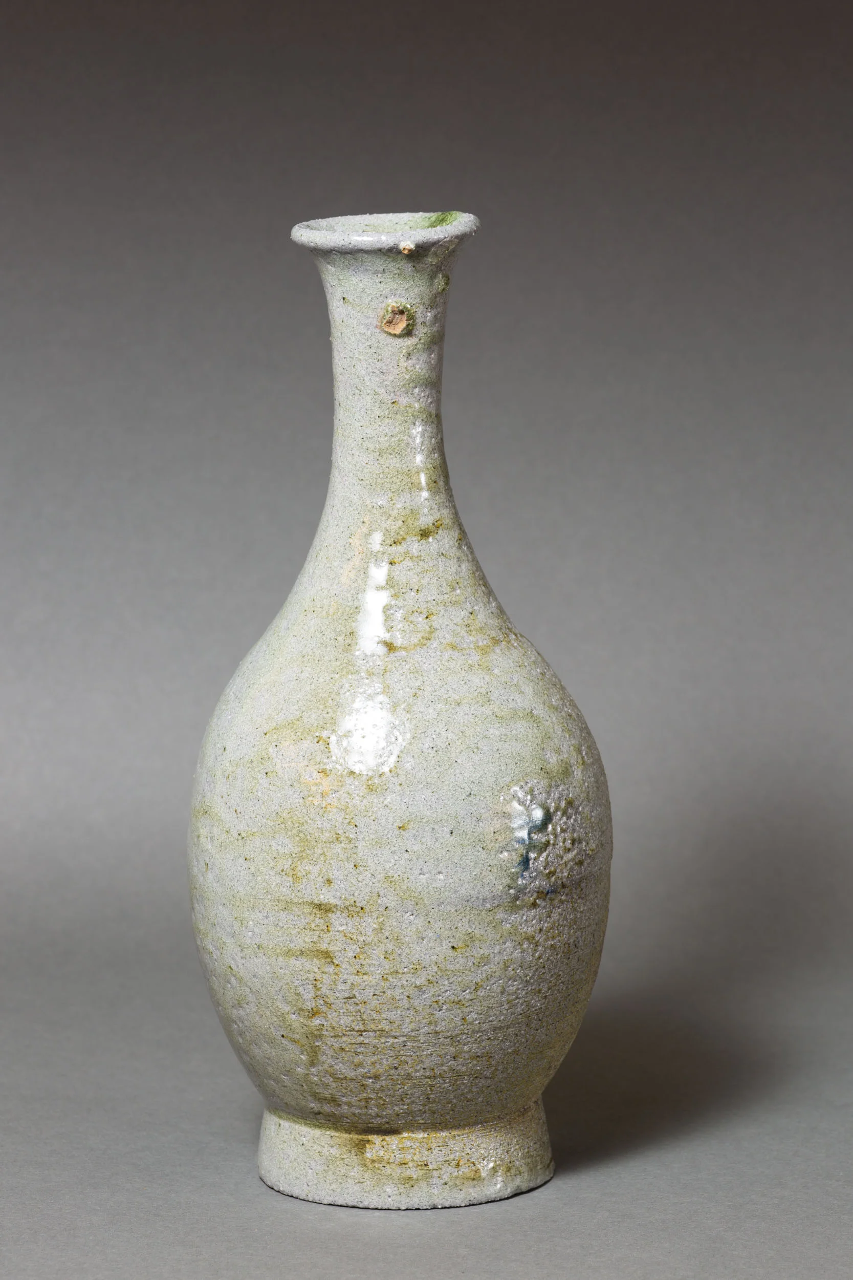   Bottle with green drip, long neck   4.5” d, 10" h  ID: 6019   