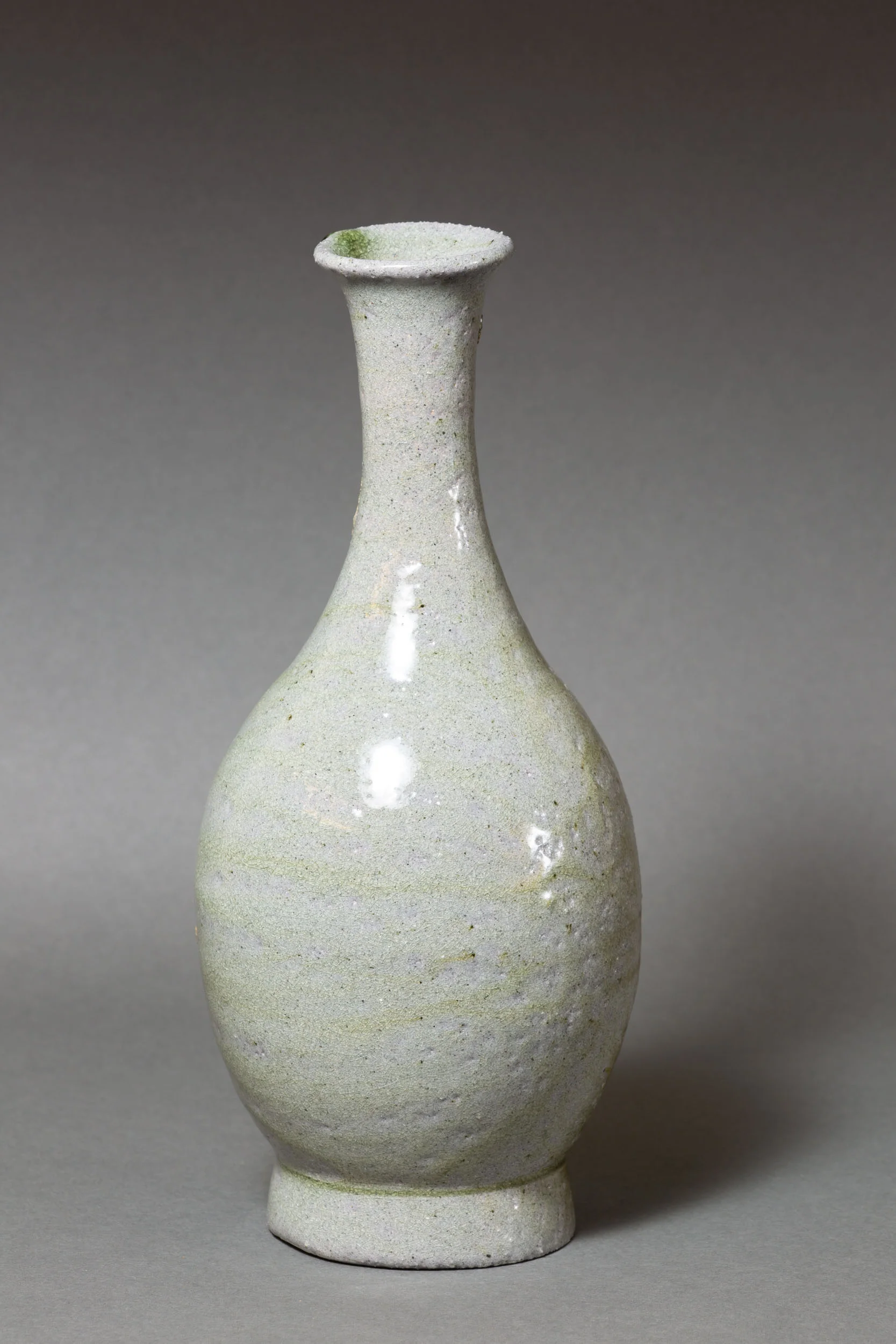   Bottle with green drip, long neck   4.5” d, 10" h  ID: 6019   