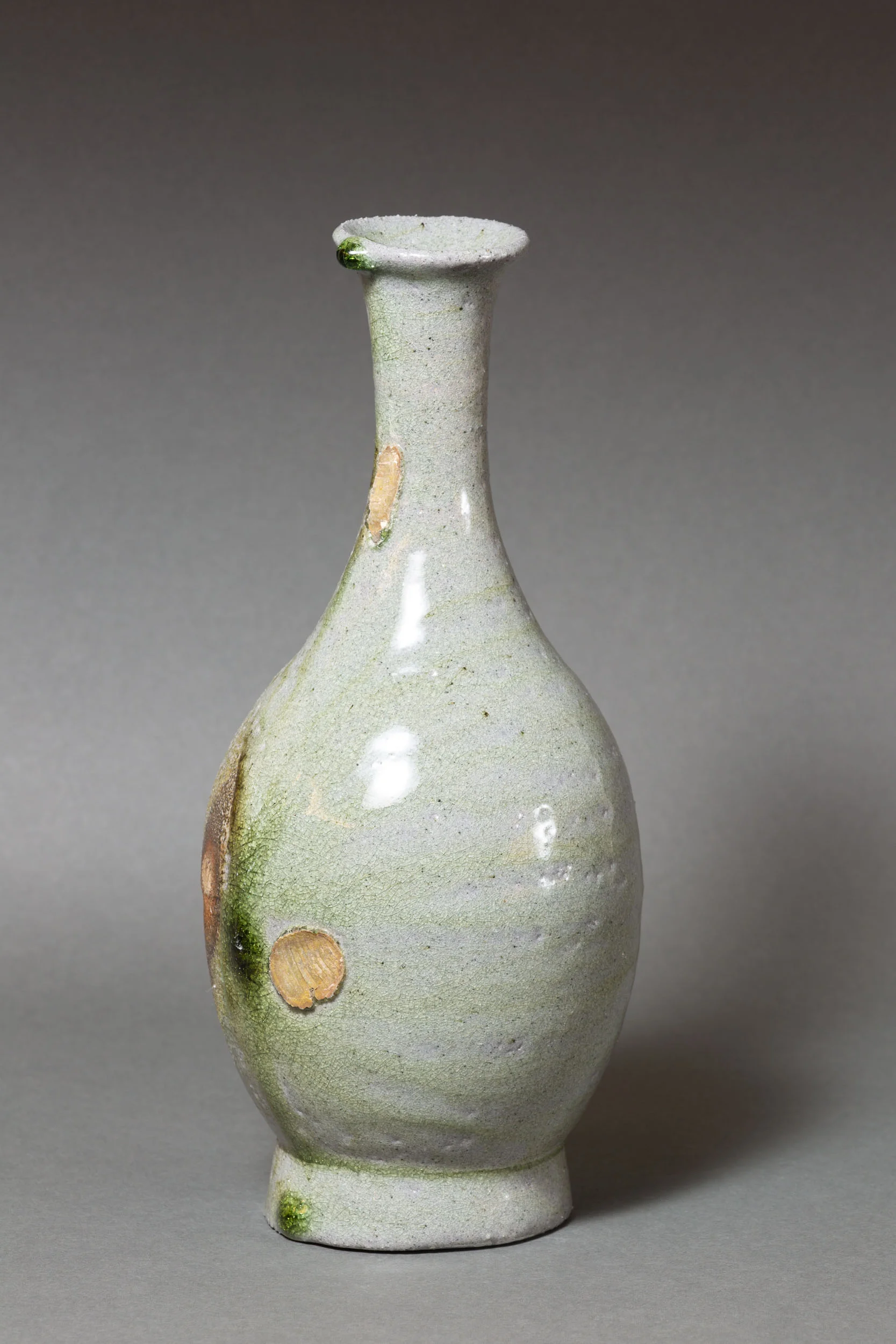   Bottle with green drip, long neck   4.5” d, 10" h  ID: 6019   