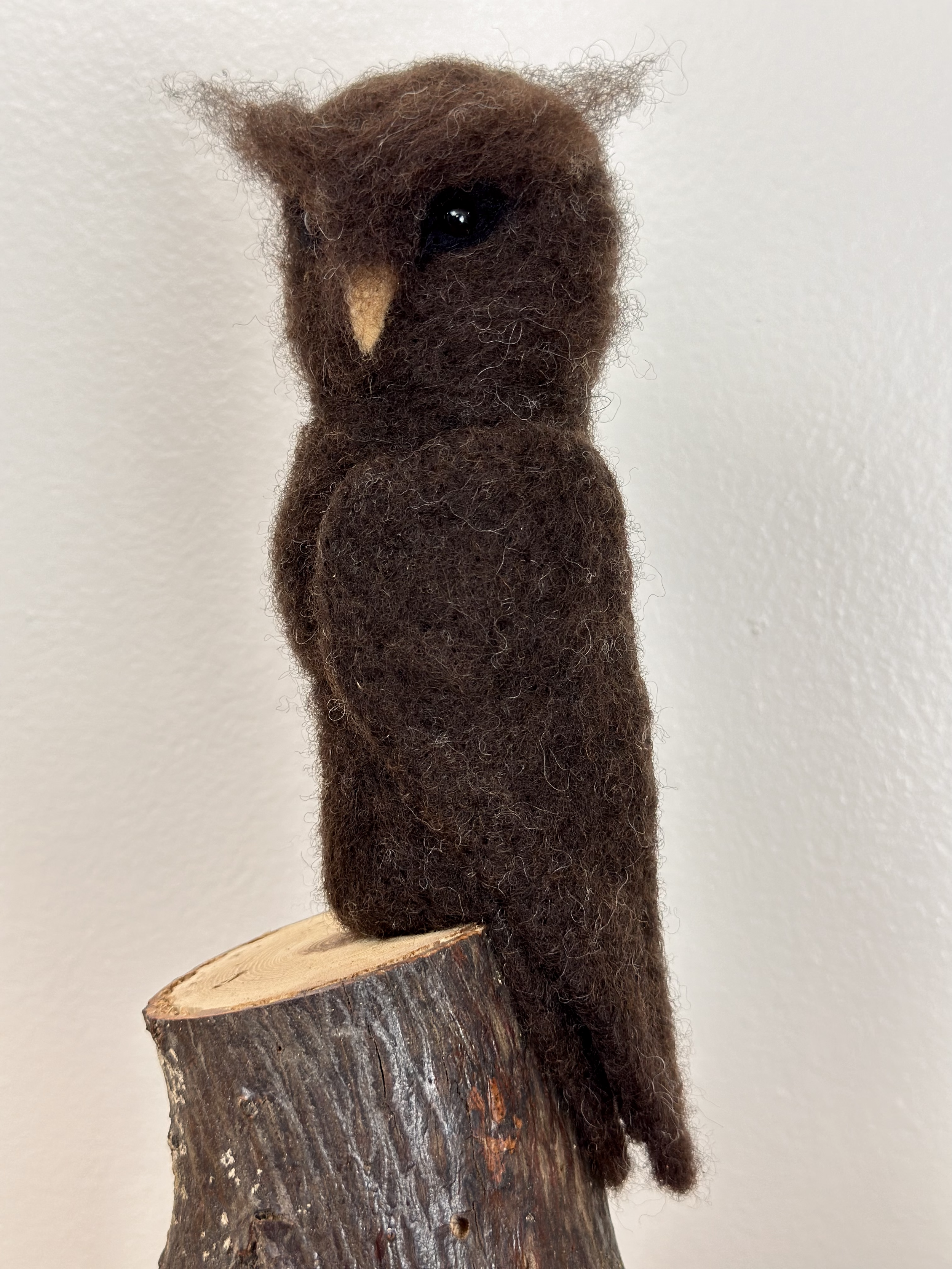 Refined and wise, Great Horned Owl, perched on a branch, handmade with Merino Wool.