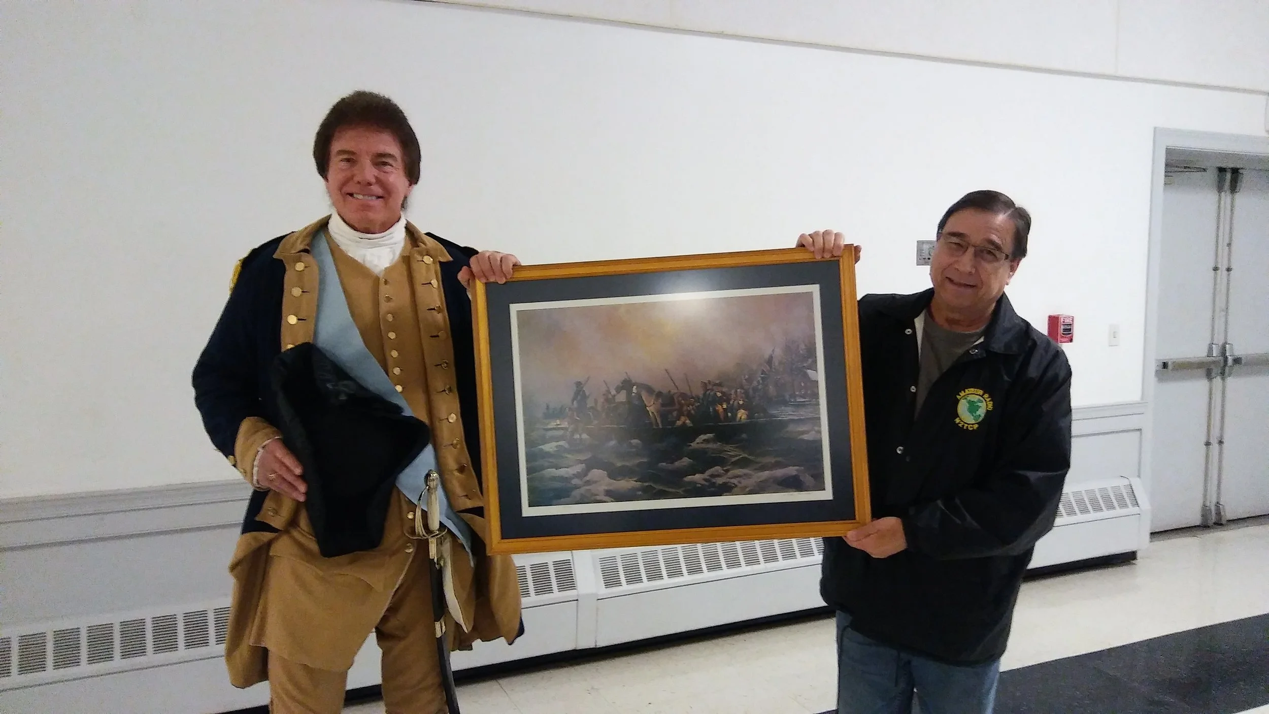 WCPA Trustee Sam Davis Presenting to the winner of the Garrison Painting Door Prize at the Washington's Crossing: Rest of the Story Event