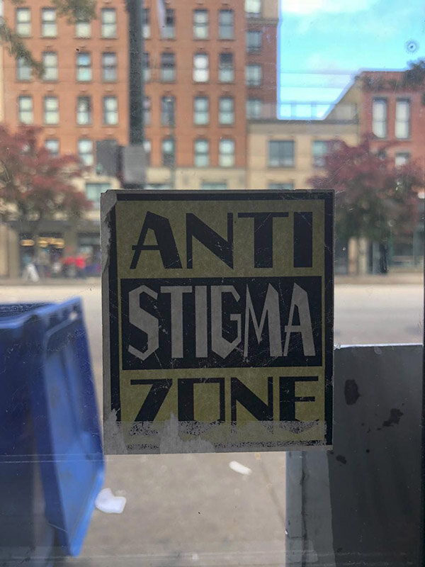 Sticker on the window of the Overdose Prevention Center Vancouver