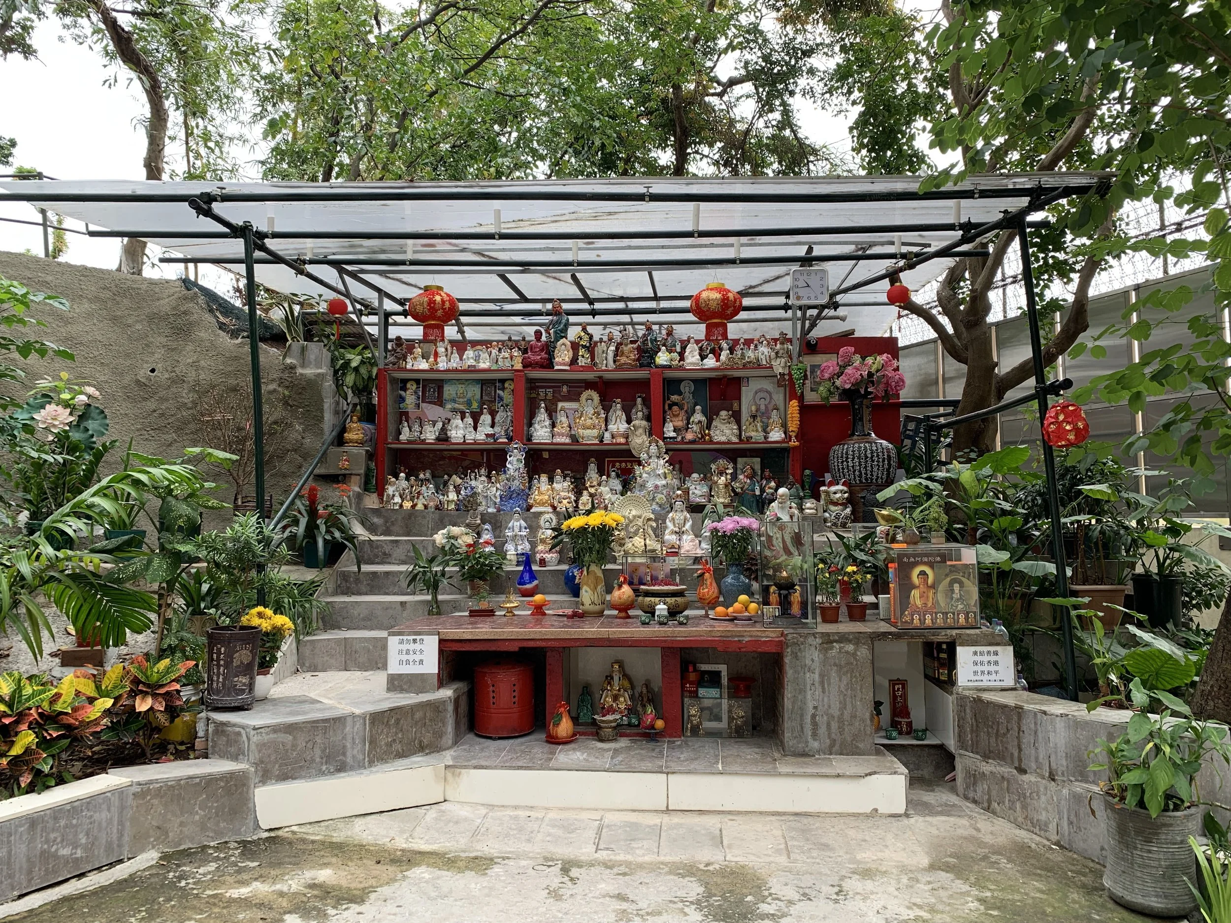 Religious artifacts from the hillside were collected and placed under this community-built shrine