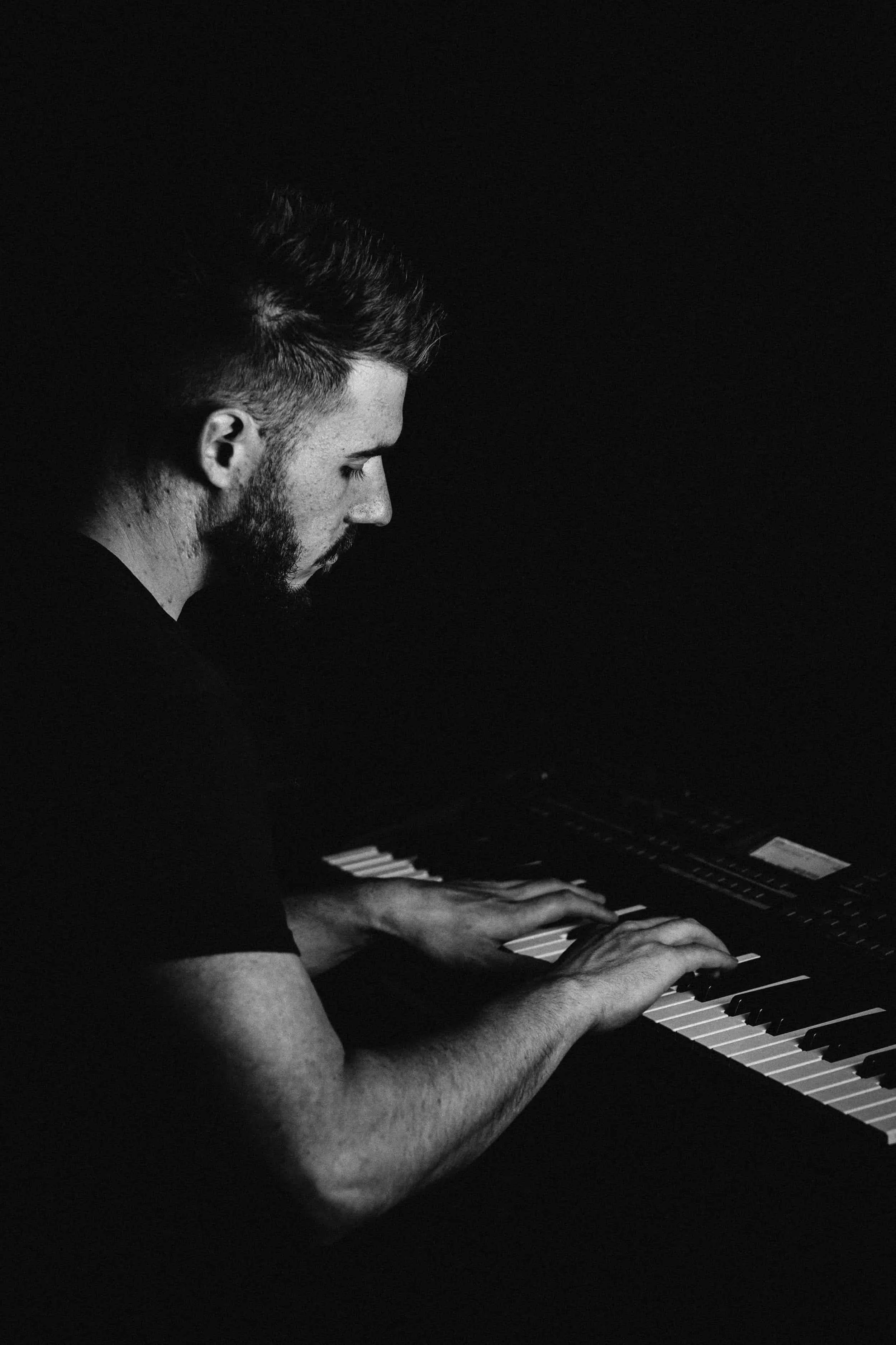 Ryan Phillips performing piano at a live event in Manchester