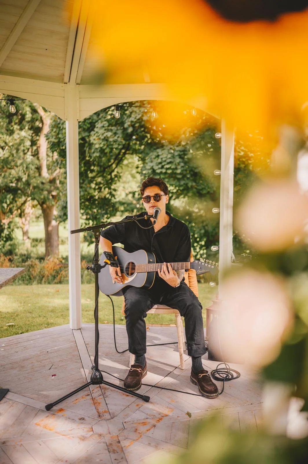 Ryan Hawkins, guitar and bass tutor in Leeds, performing live at an outdoor wedding