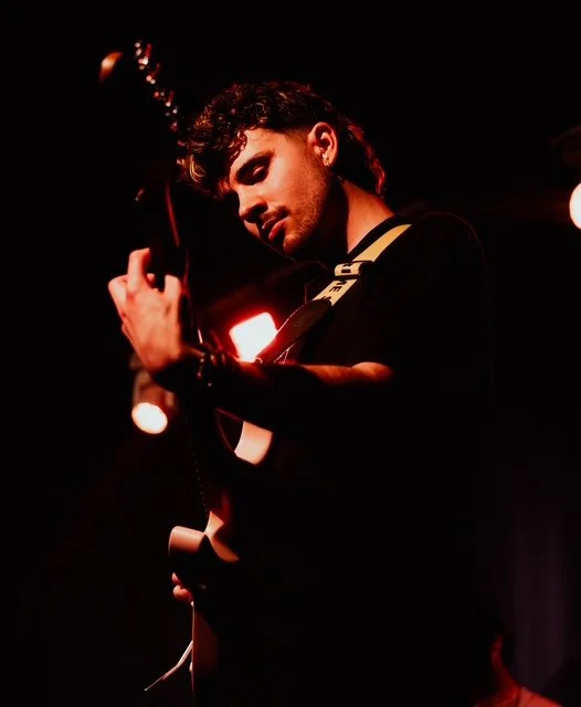 Matyas Price-Jones, guitar tutor in Wilmslow, playing electric guitar live on stage