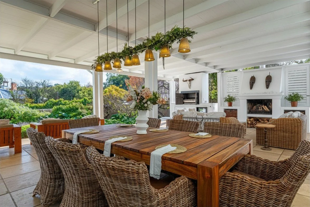 Westcliff farmhouse covered veranda with outdoor dining