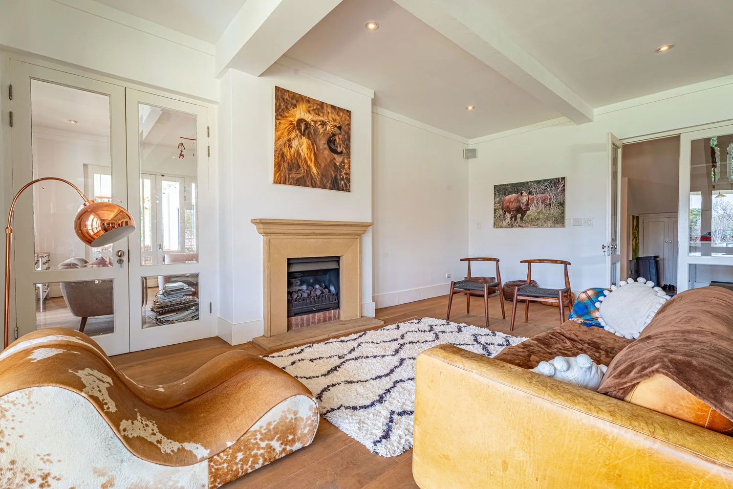 Family lounge with fireplace and French doors