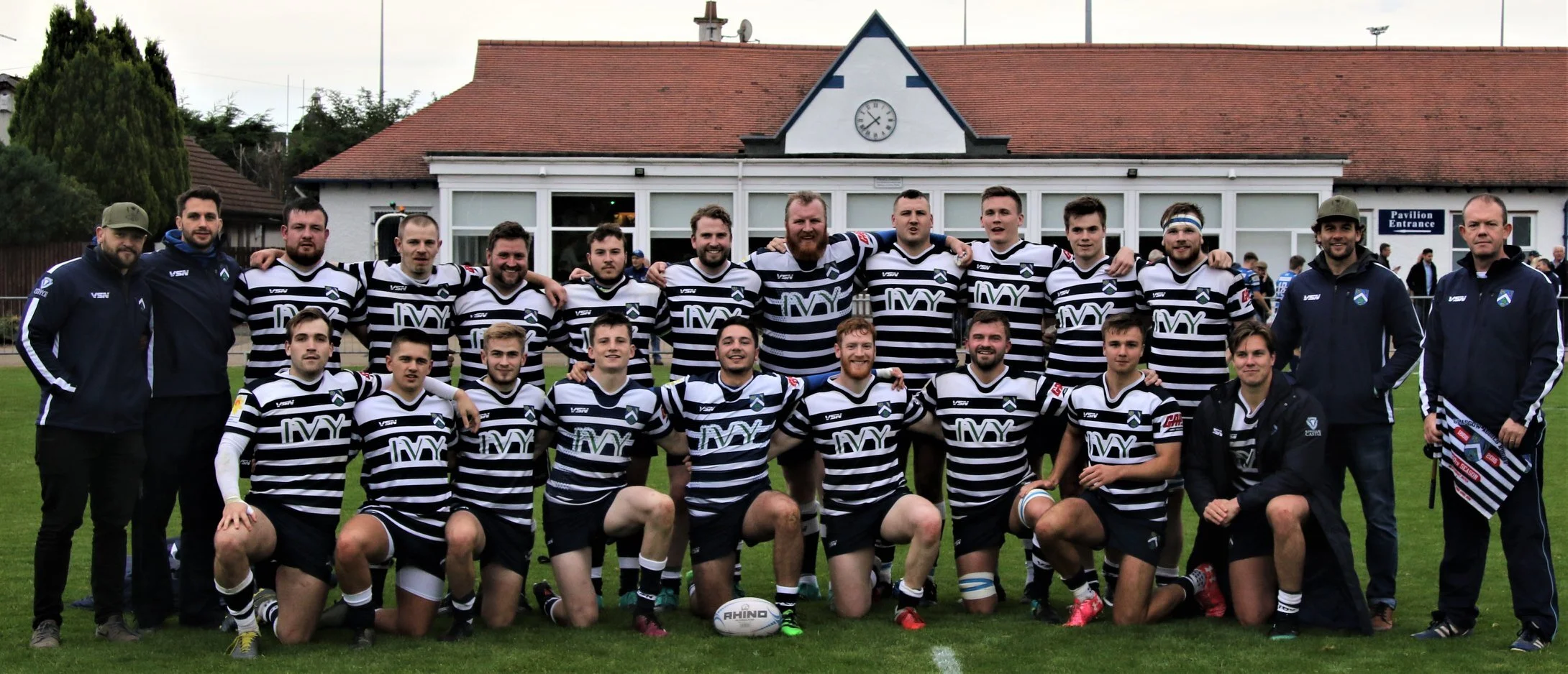 A happy team, coaches and Touch Judge