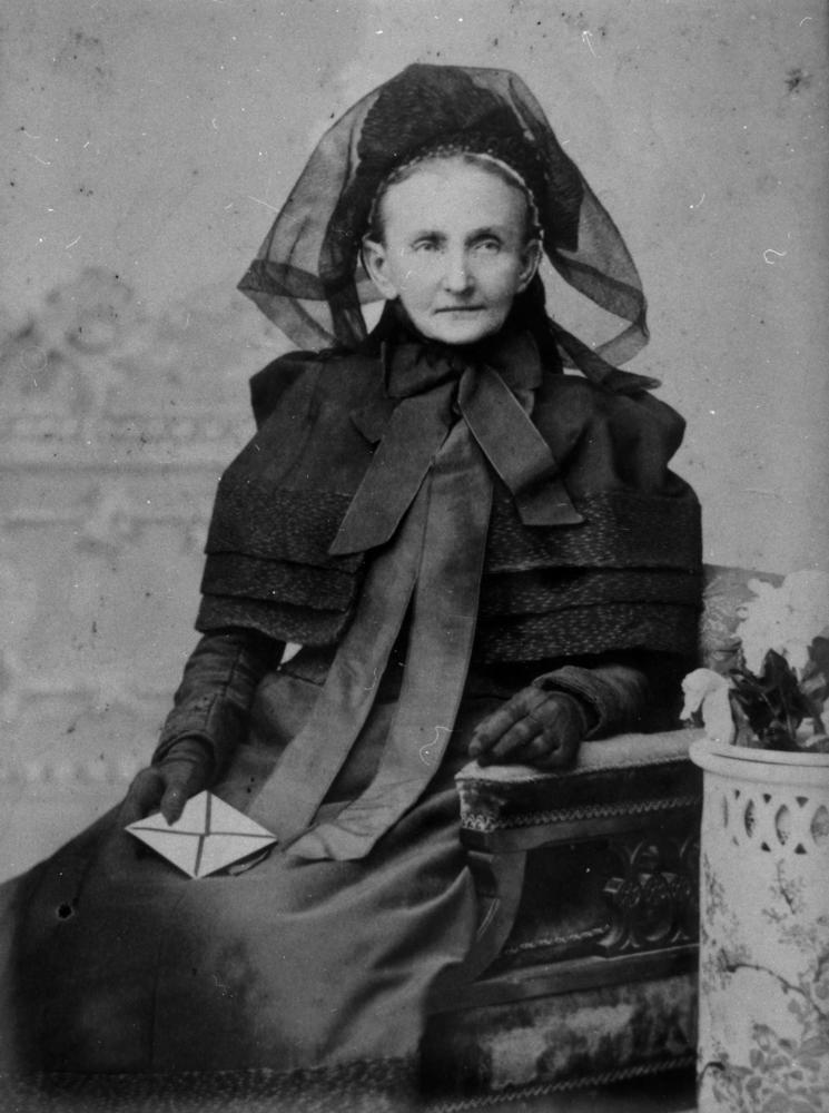 StateLibQld_1_130771_Elderly_woman_possibly_dressed_in_mourning_clothes_1890-1900.jpg