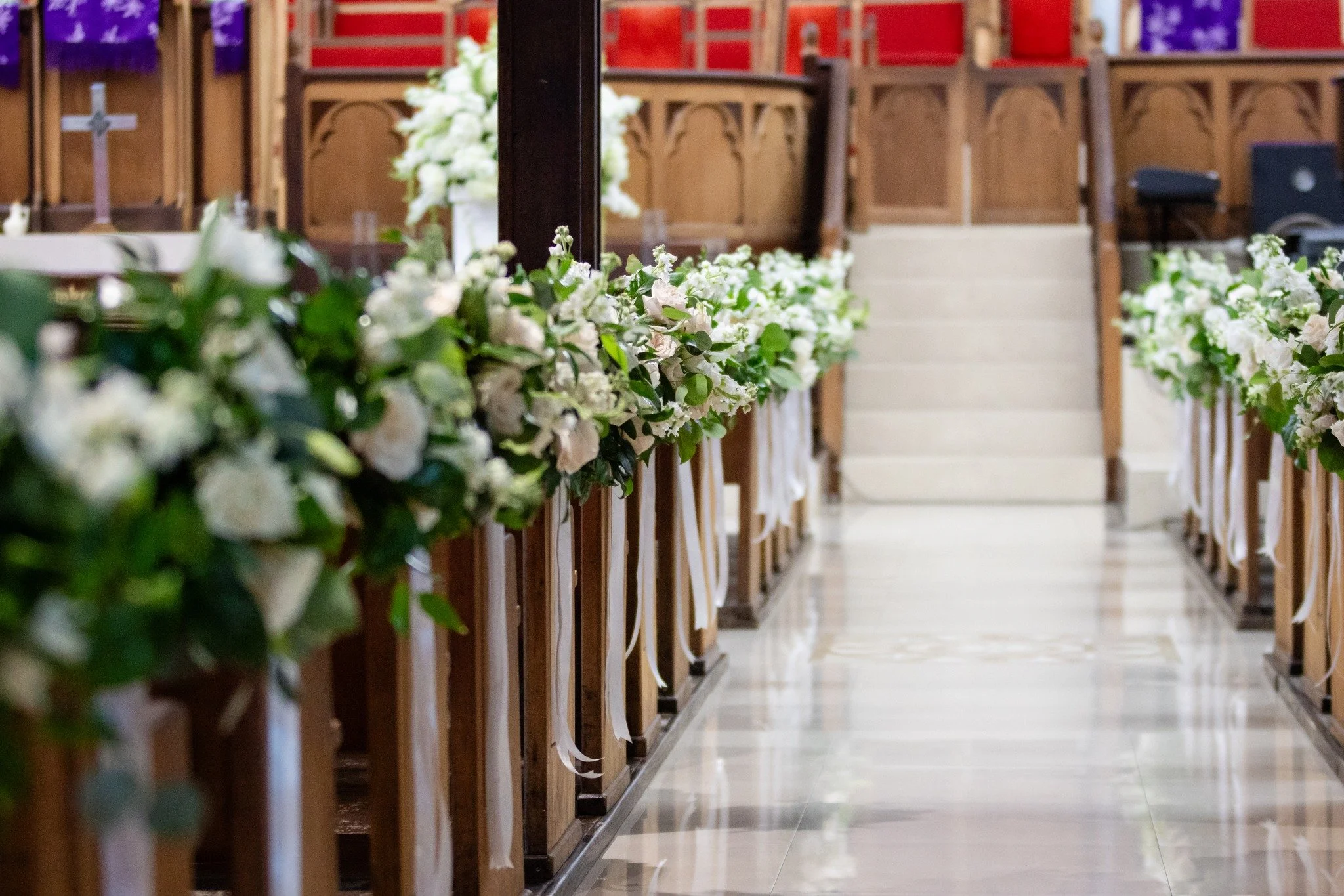 Two moods, one story.

A timeless ceremony softened by white florals in a historic downtown church.
A reception that shifted into deep purples, candlelight, and gothic romance.

WBC was proud to bring both sides to life&mdash;honouring tradition whil