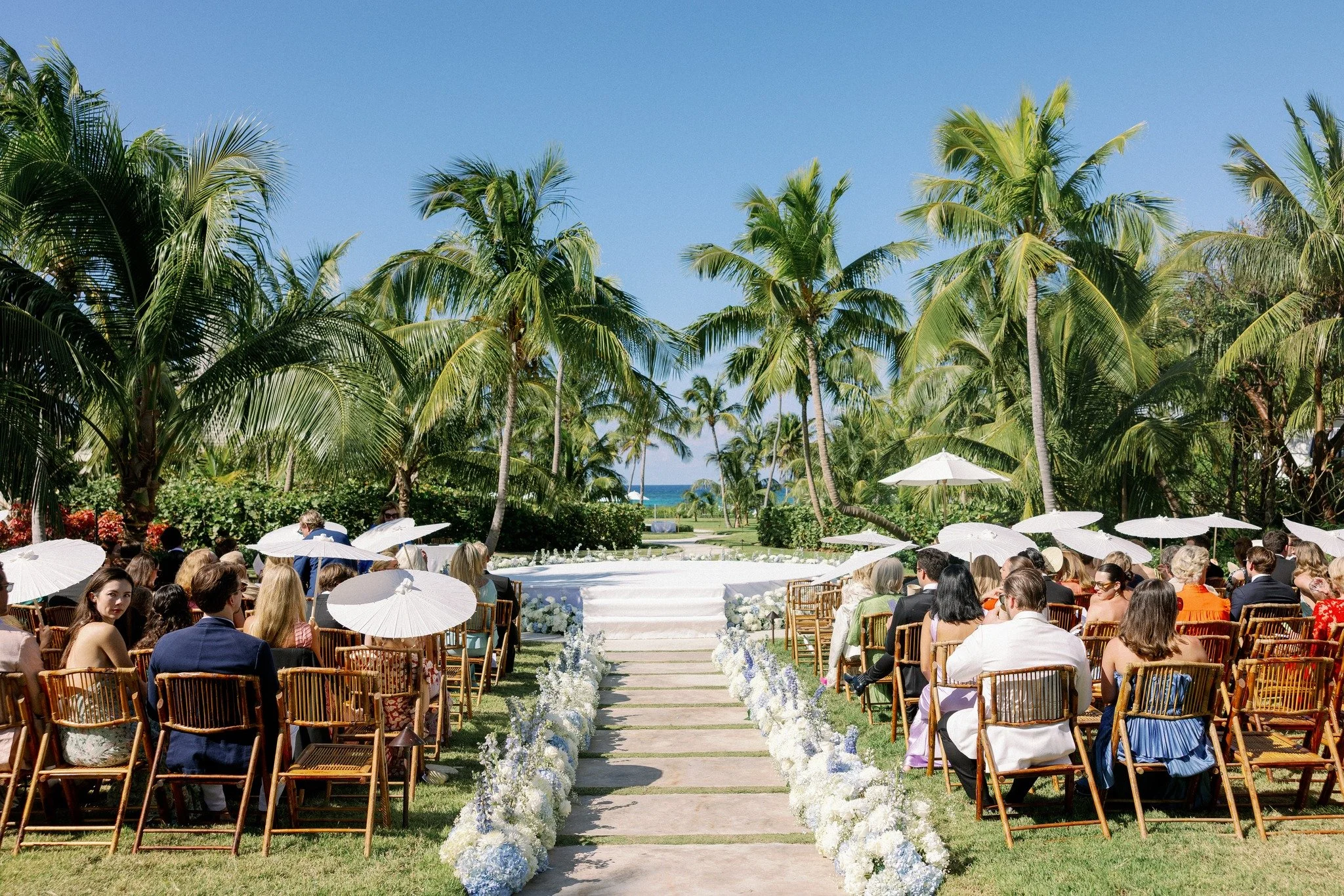 And now, we step out from behind the fronds.

For The Willis Flemings, a love story began to unfold beneath the palms of Eleuthera &mdash; quietly composed, deeply personal, and touched with the kind of beauty that lingers.

The first chapter, told b