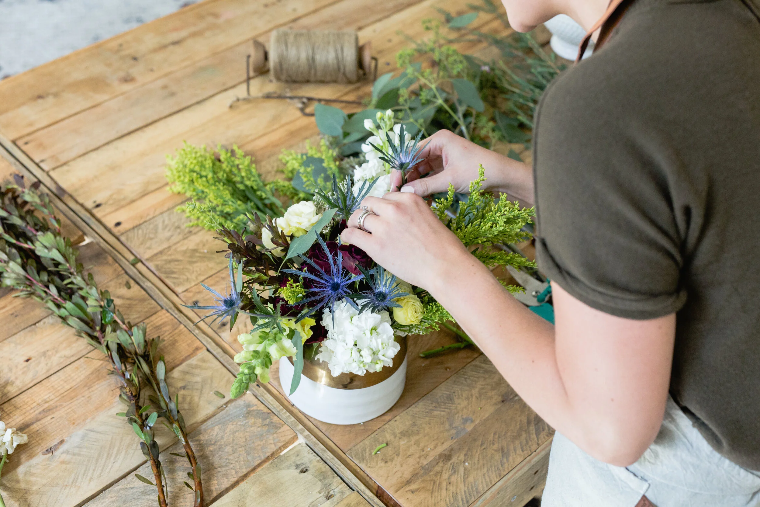 A florist arranges beautiful flowers