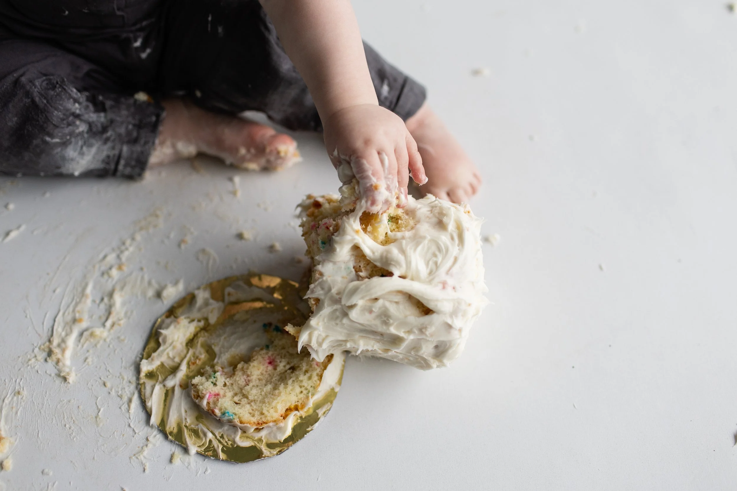 cake-smash-close-up-baby-toes-fingers-messy-studio.jpg
