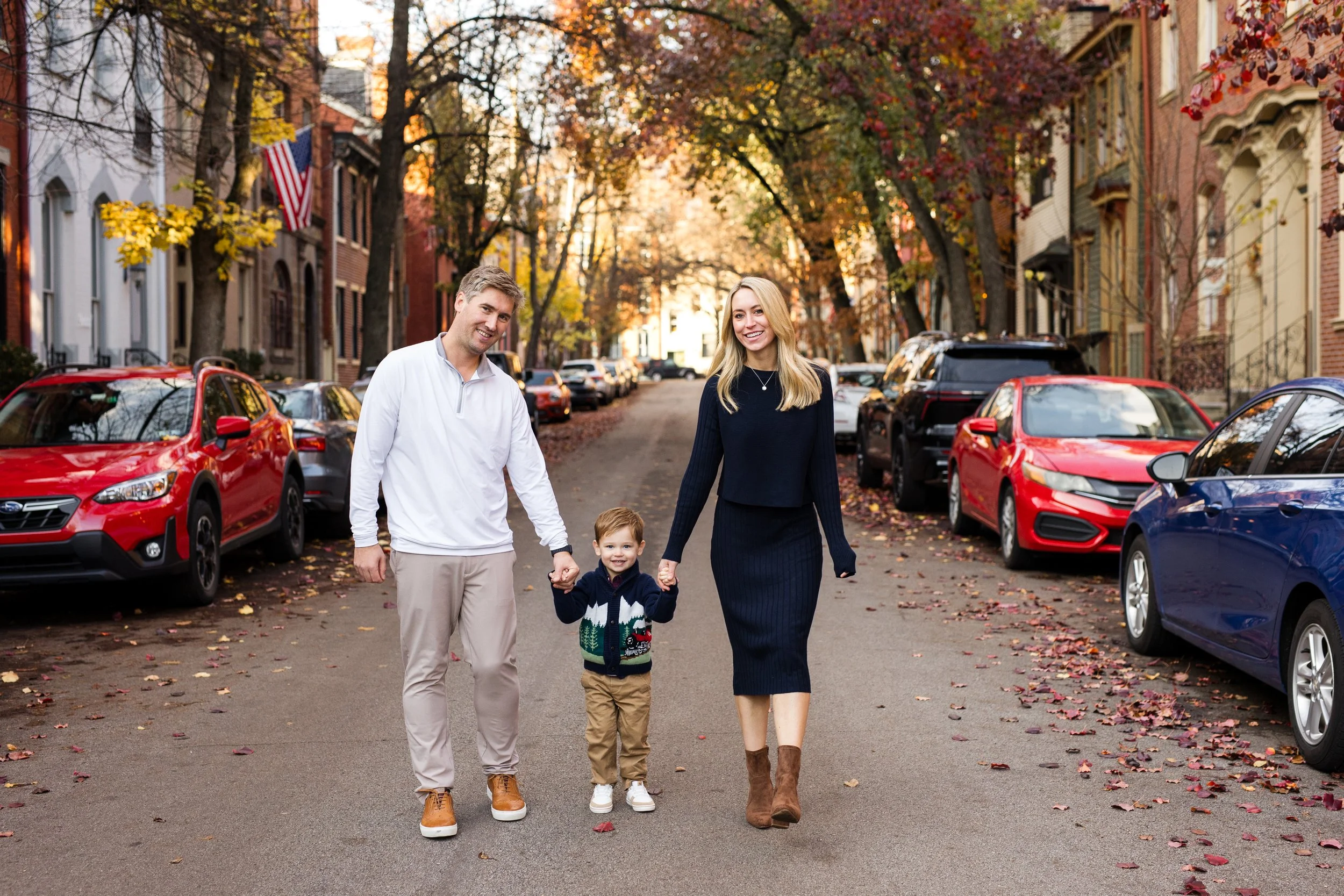 A family walks through the streets of Pittsburgh Mexican War Streets
