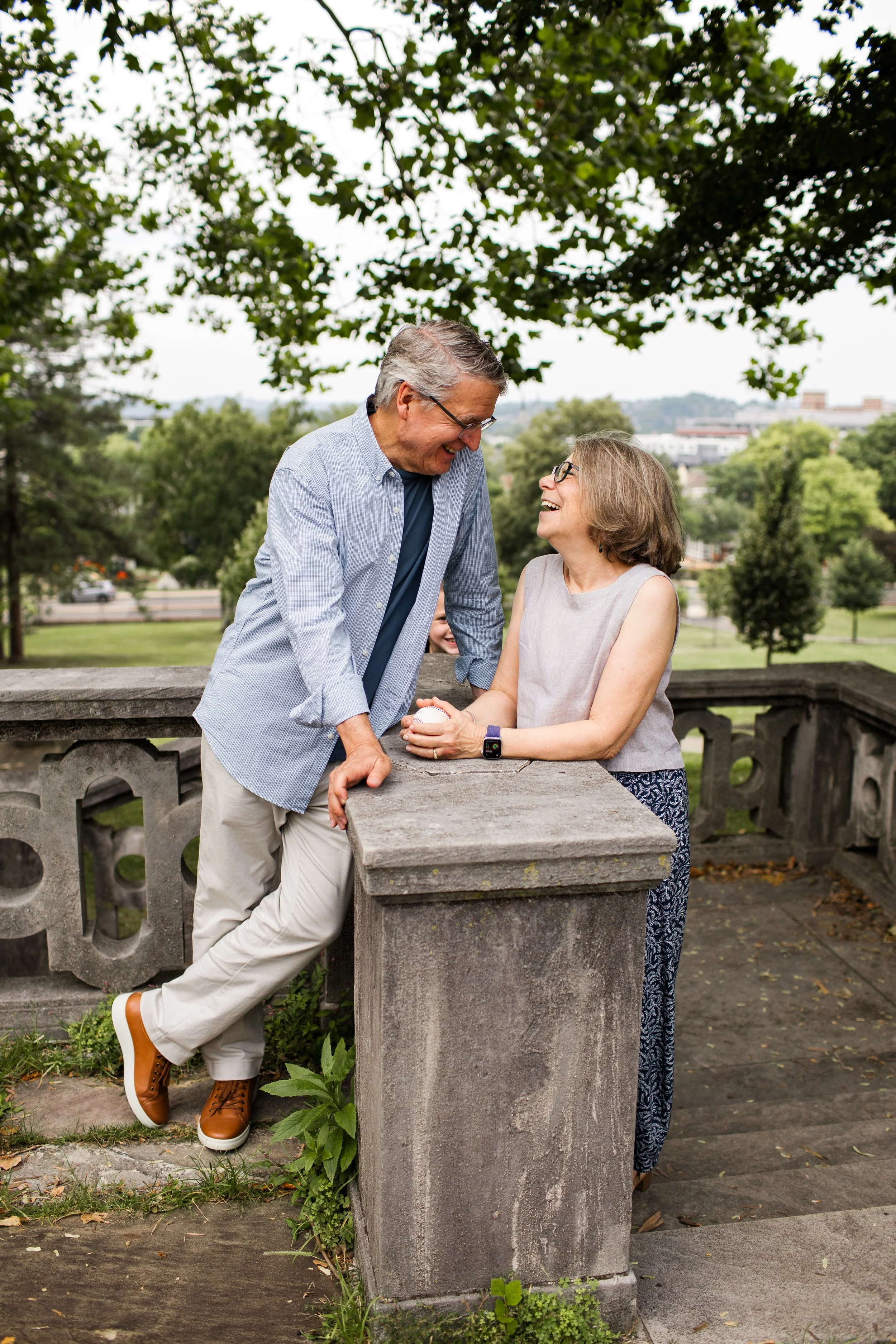 Grandparents share a candid moment as they chat at Mellon Park