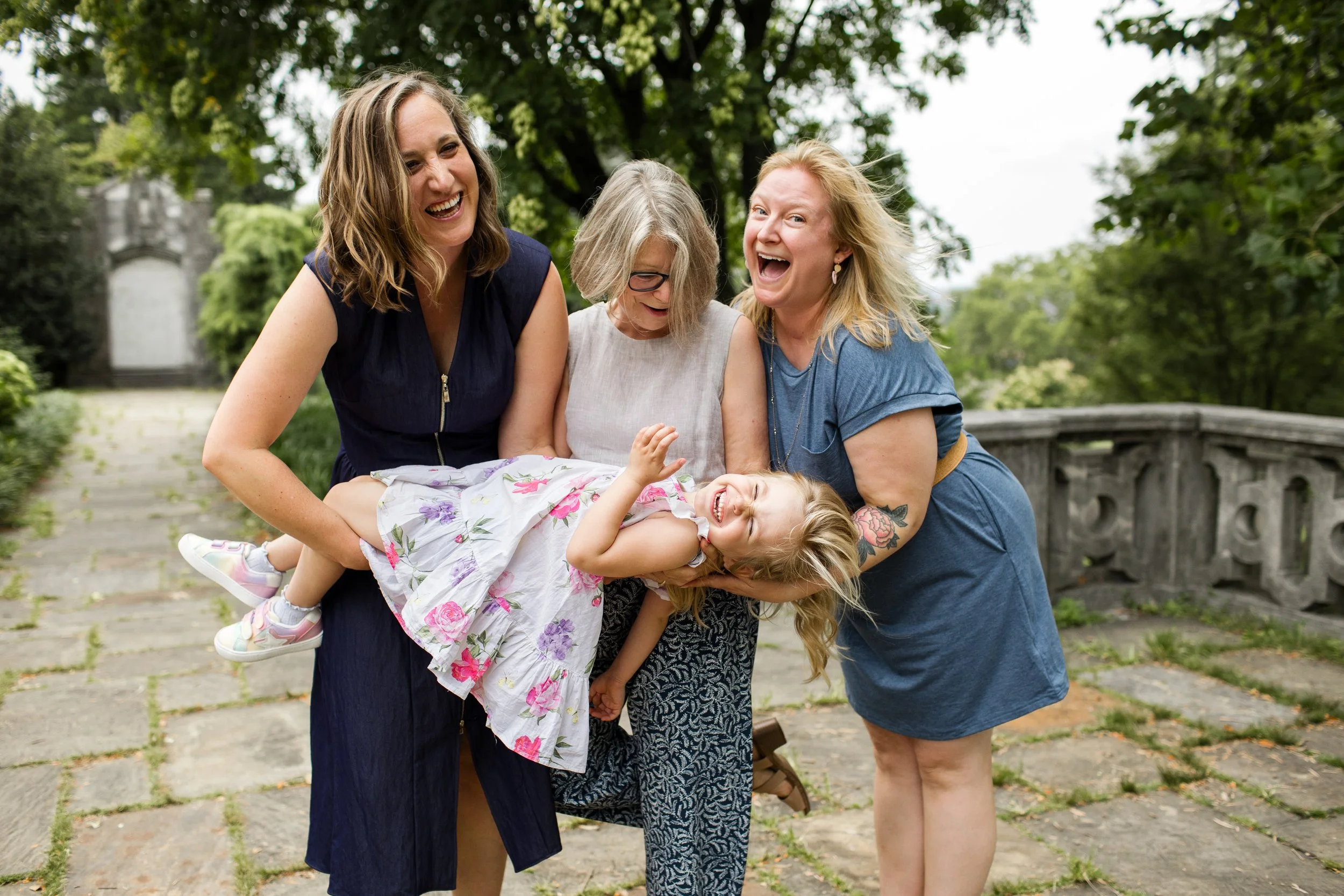 Girls pic! All the women in the extended family get together, laughing as they hold the youngest