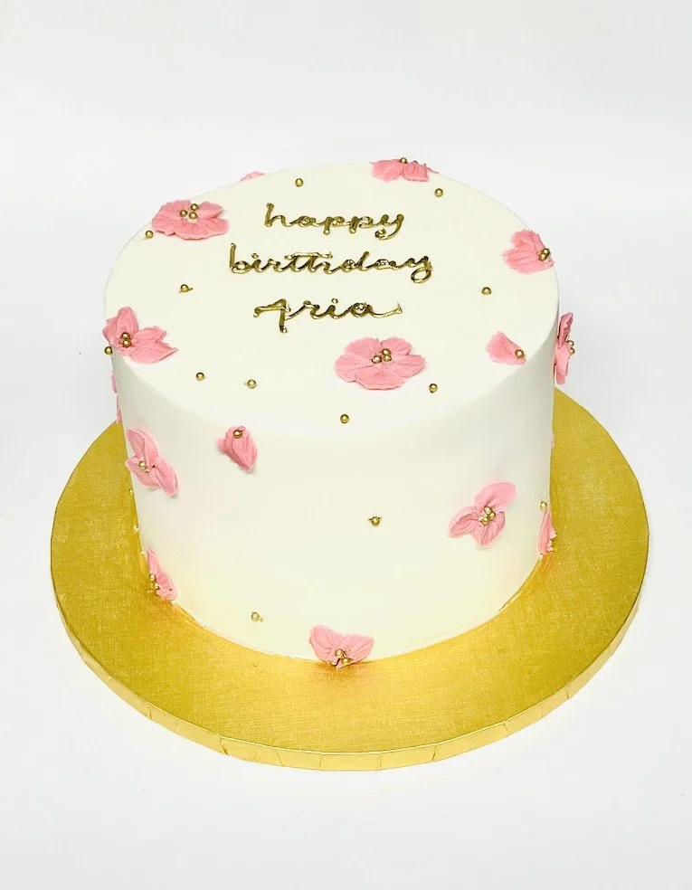 8 in white with pink piped little flowers and gold writing.jpg