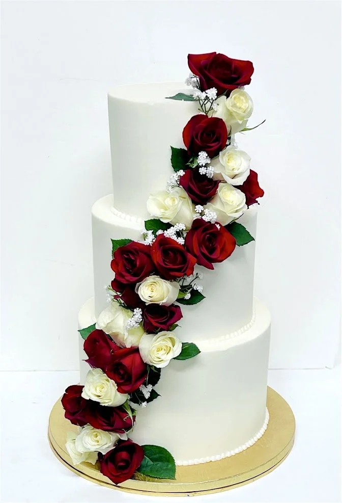 solid with red and cream roses cascading.jpg