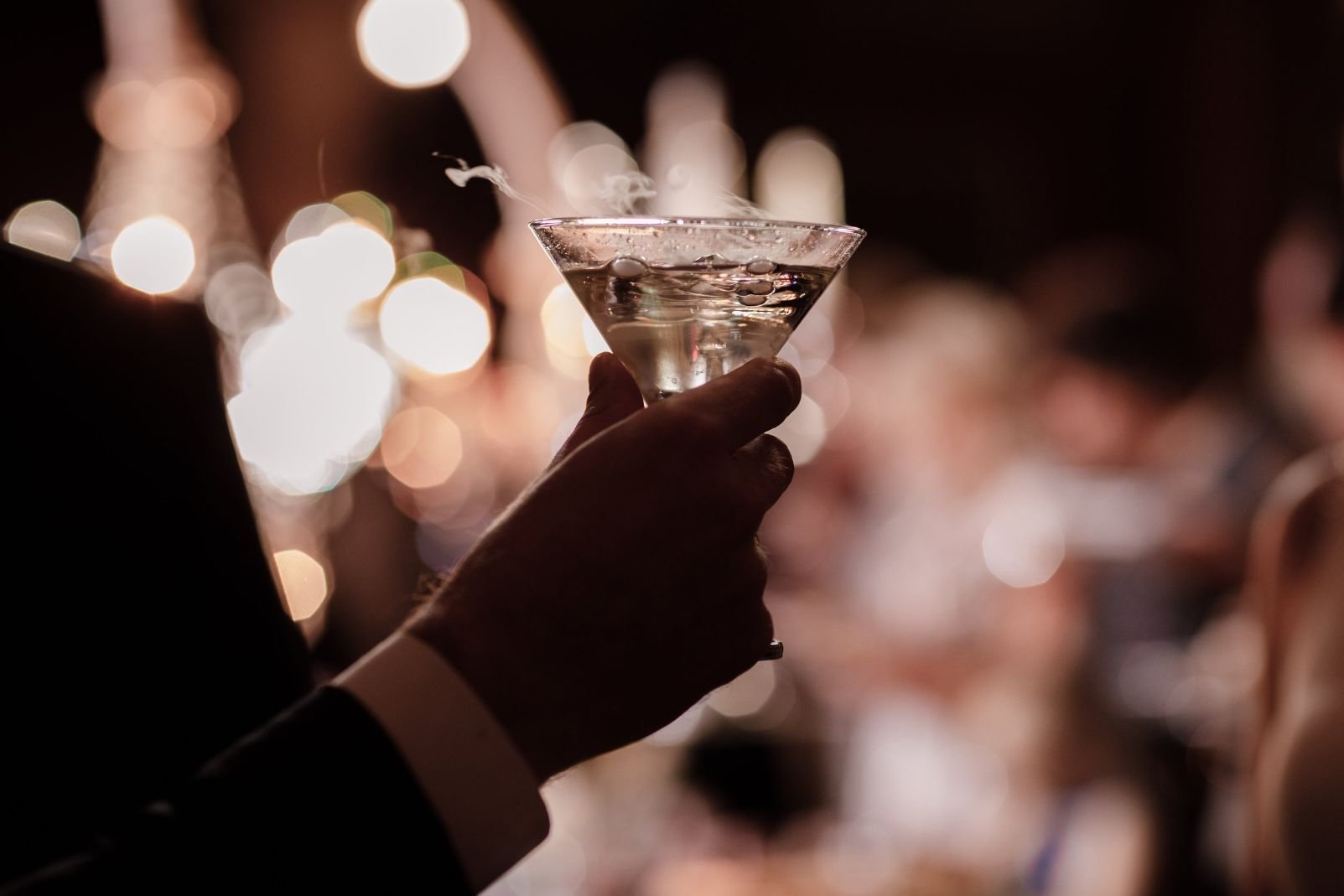2023-secret-dinner-zurich-casino-royale-man-holding-martini glass.jpg