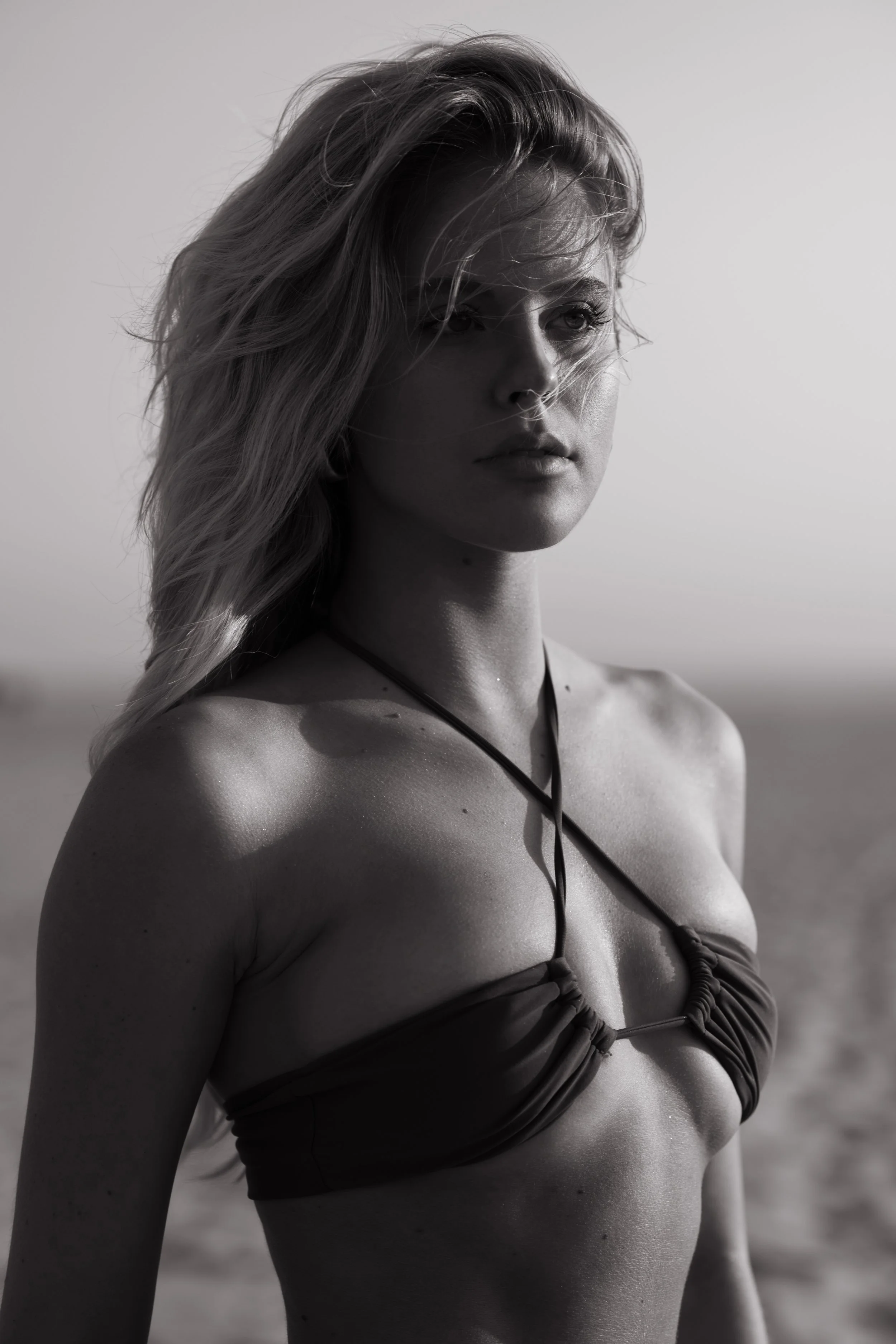  Black and white swimwear portrait with clean lines and windblown hair 