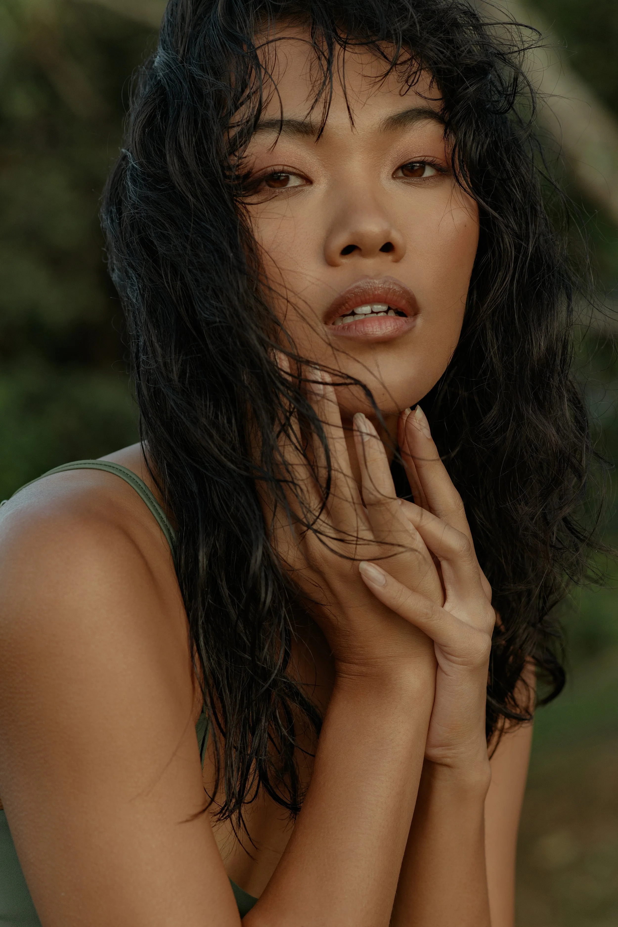  Beauty portrait of model with wet hair and natural makeup in soft light 