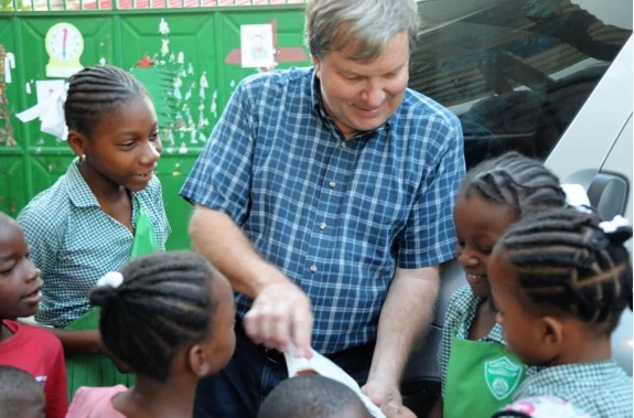 Fr. John teaching kids before they head for school.