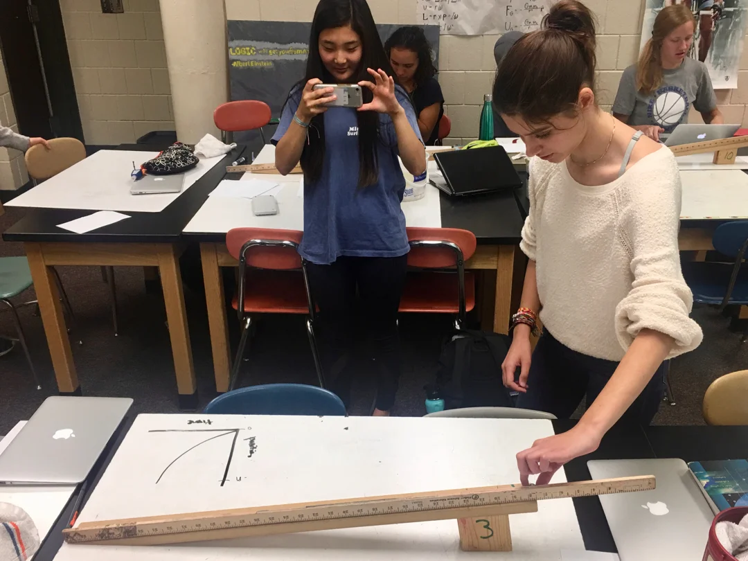 Students enjoy making their own videos and analyzing them. Here, students at Henry Sibley High School record video they’ll use to analyze motion with constant acceleration.