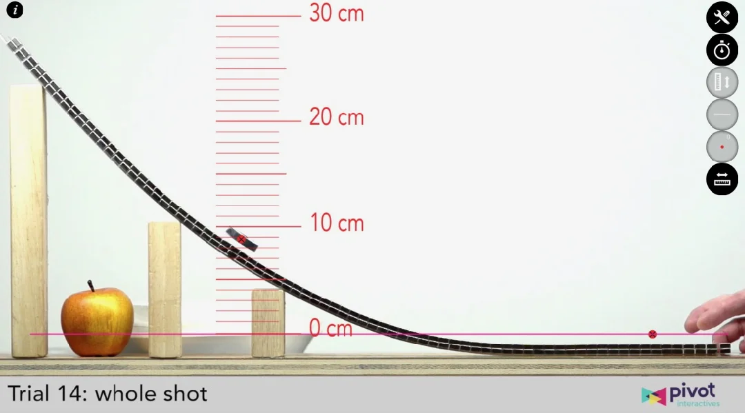 A second video is unlocked after students submit their prediction. This video shows the same event as their original video, but this time they can see the puck rise to its maximum height, allowing them to measure to test their prediction.
