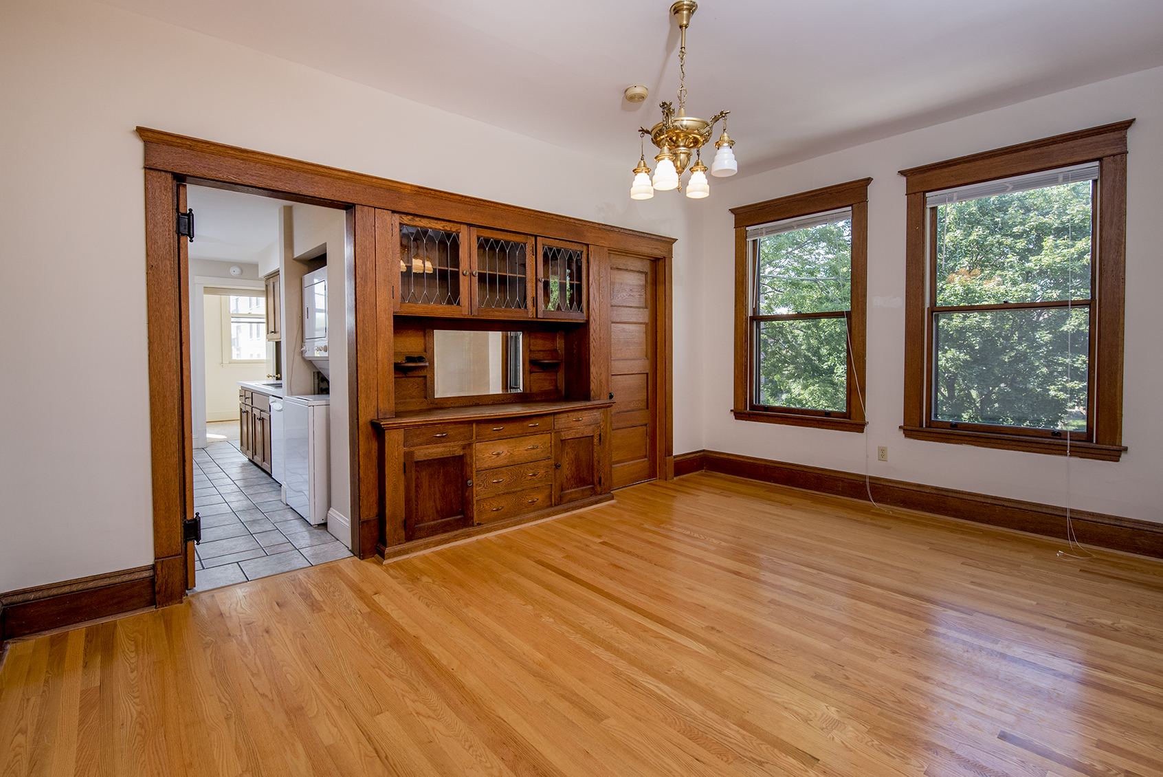Formal dining room with a fabulous built in and gorgeous woodwork.