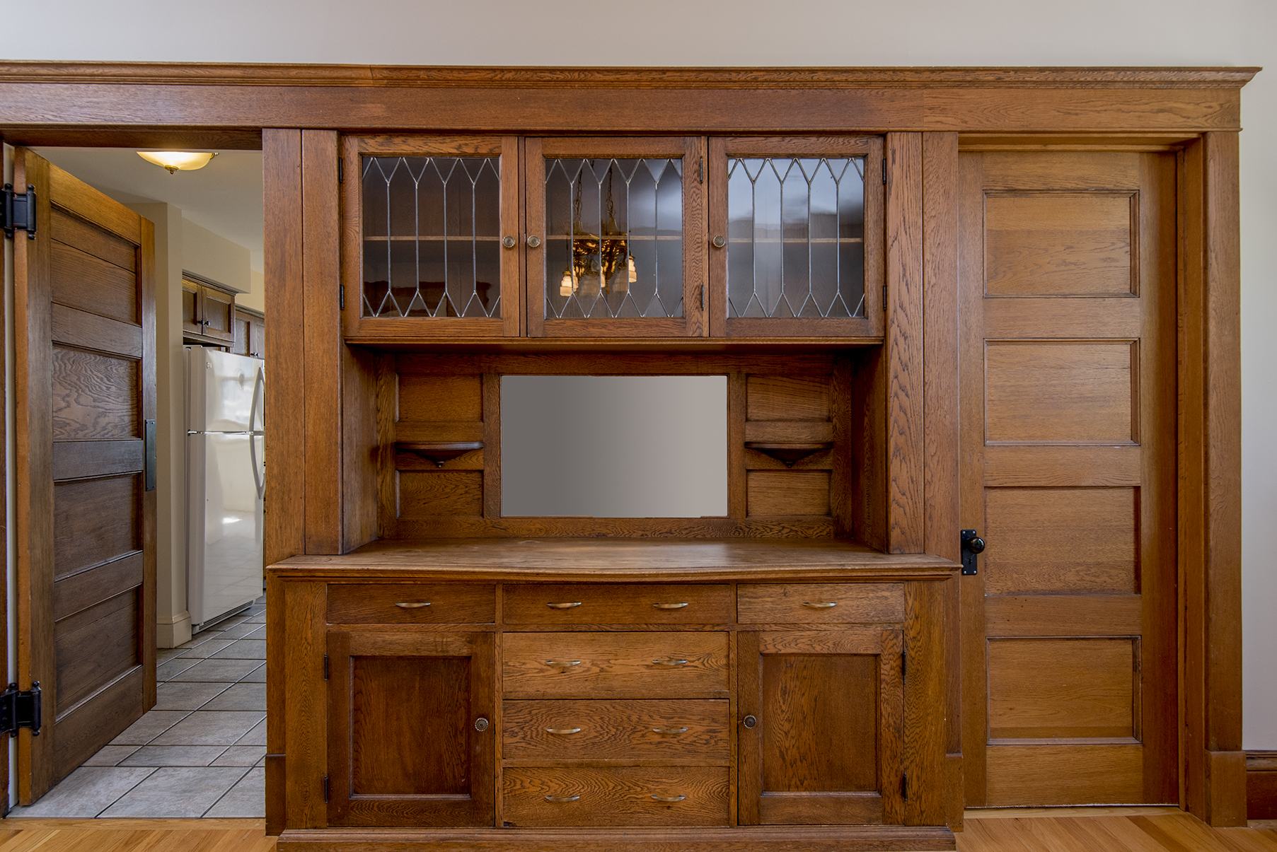 Through the closed door is one of the bedrooms.
