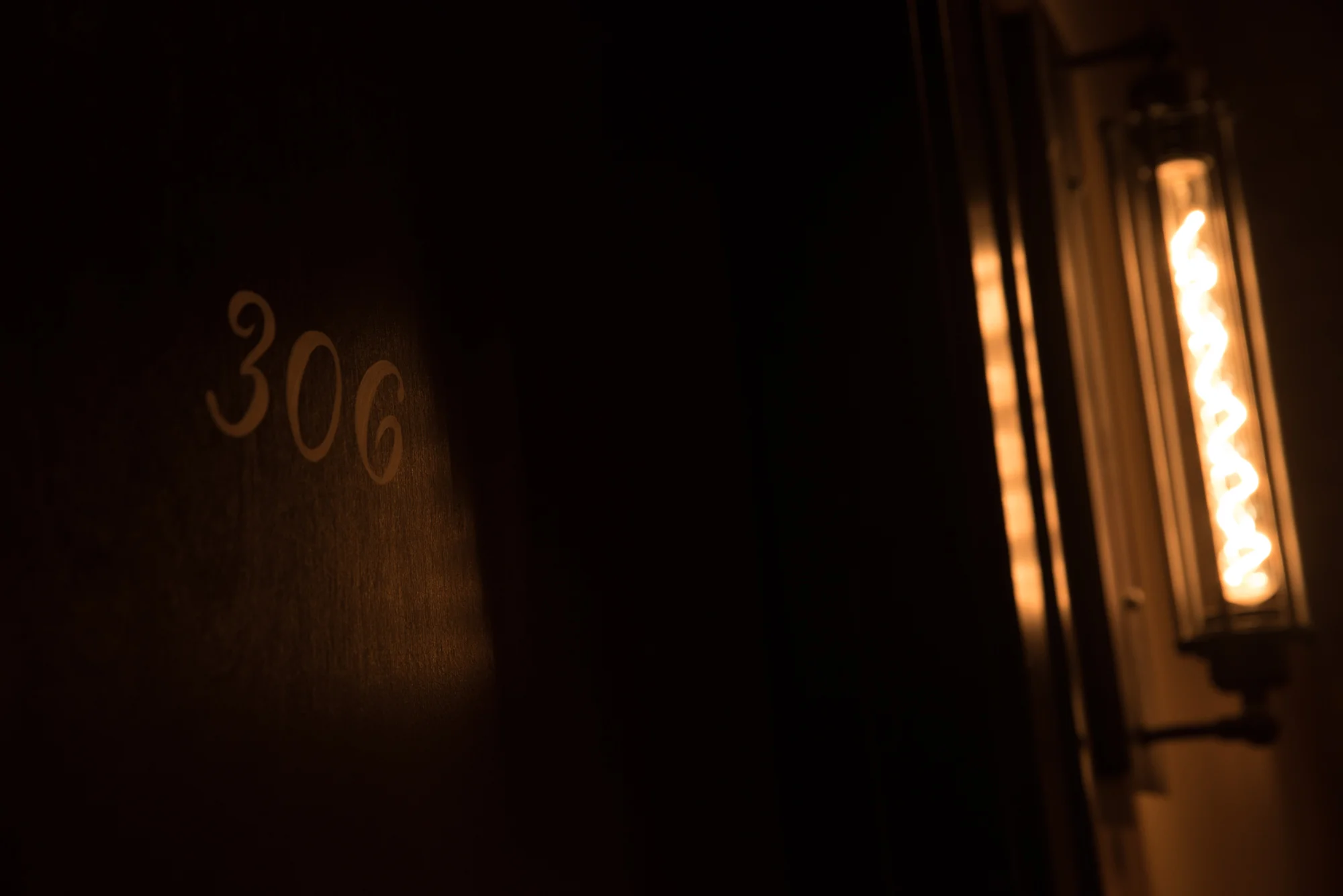 Hand painted apartments numbers adorn each apartment door