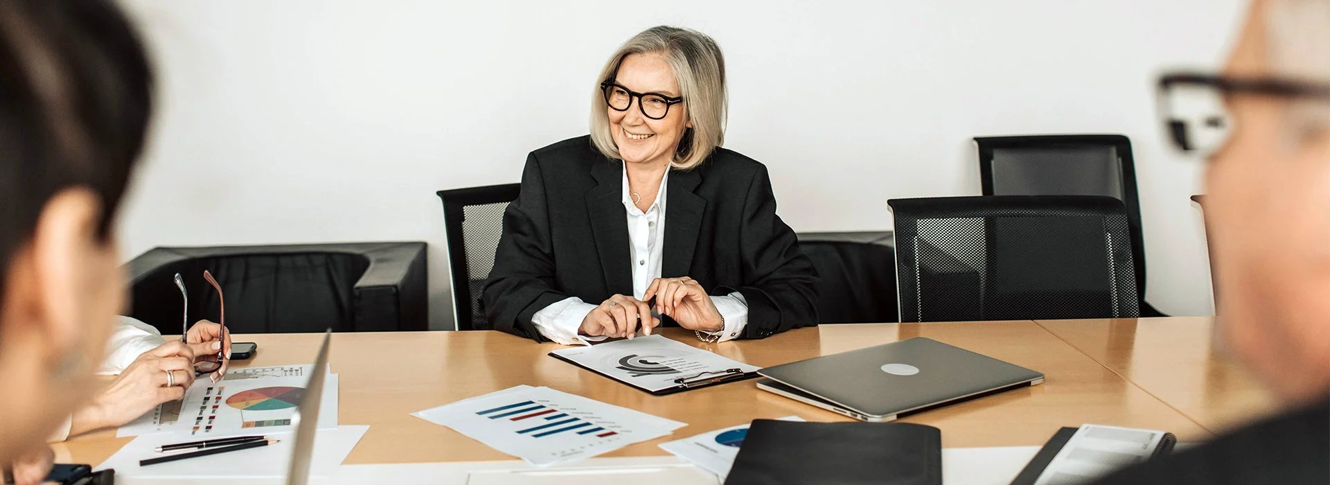 Smiling executive in a board meeting