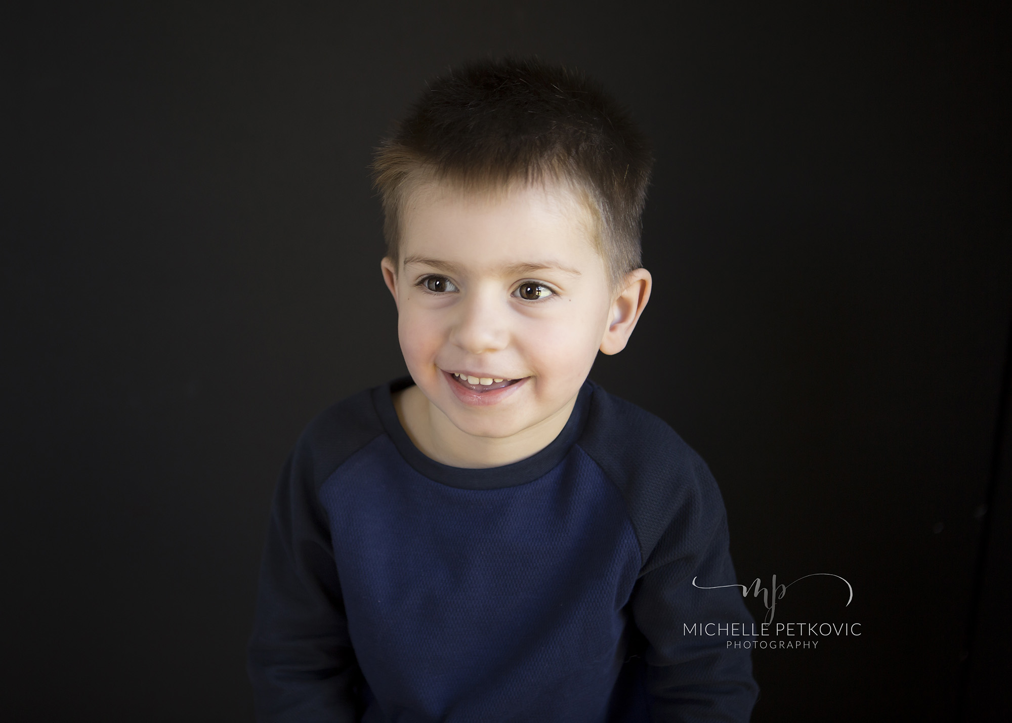 boy-black-background-studio-photography.jpg