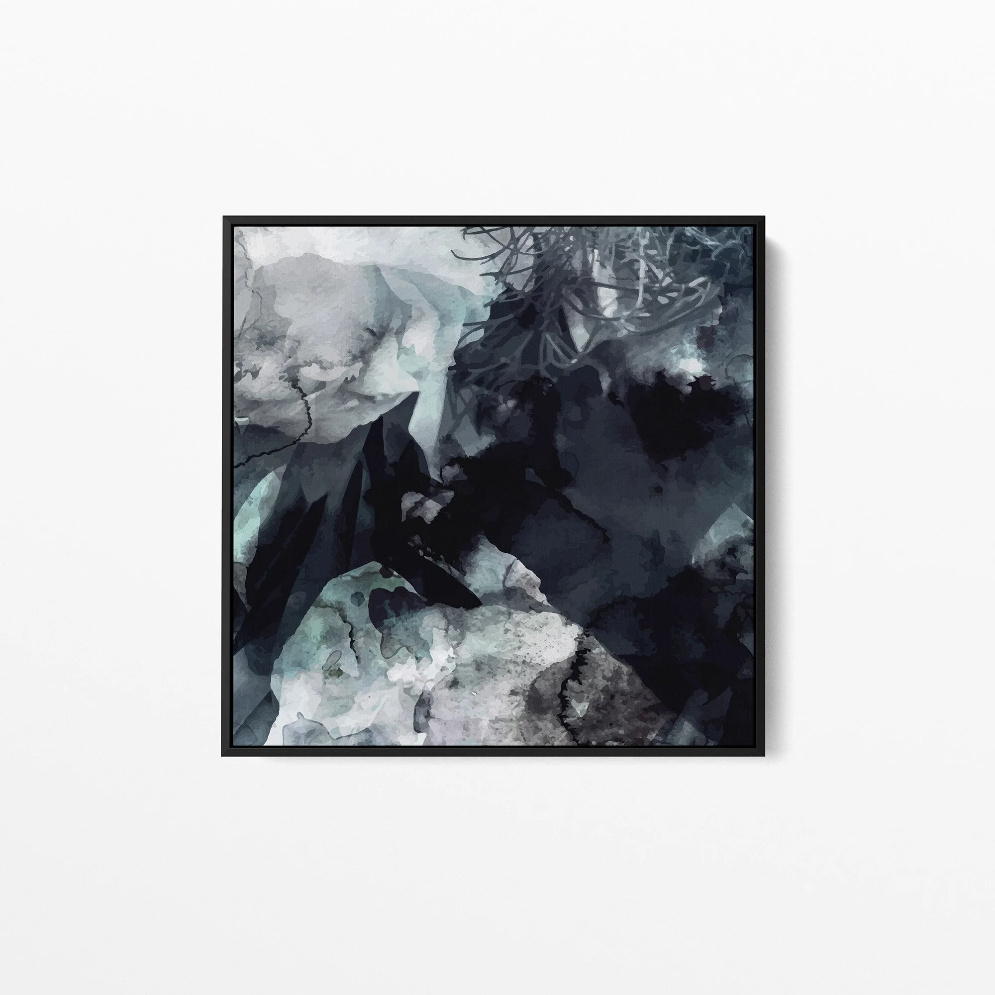 A square canvas print that features abstract foliage in watercolour hangs on a white wall. The artwork is framed in black. The colours in the artwork are grey, deep blue, indigo and aqua.