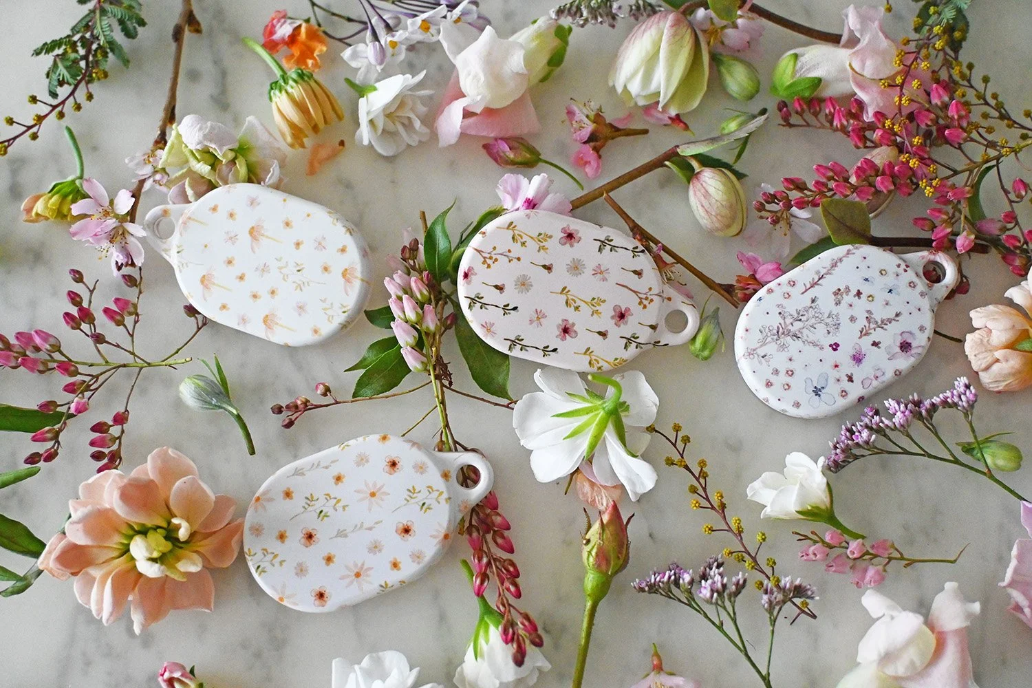 The Prettiest AirTag Cases for Bags, Keys &amp; Travel (Cute &amp; Floral Ideas)