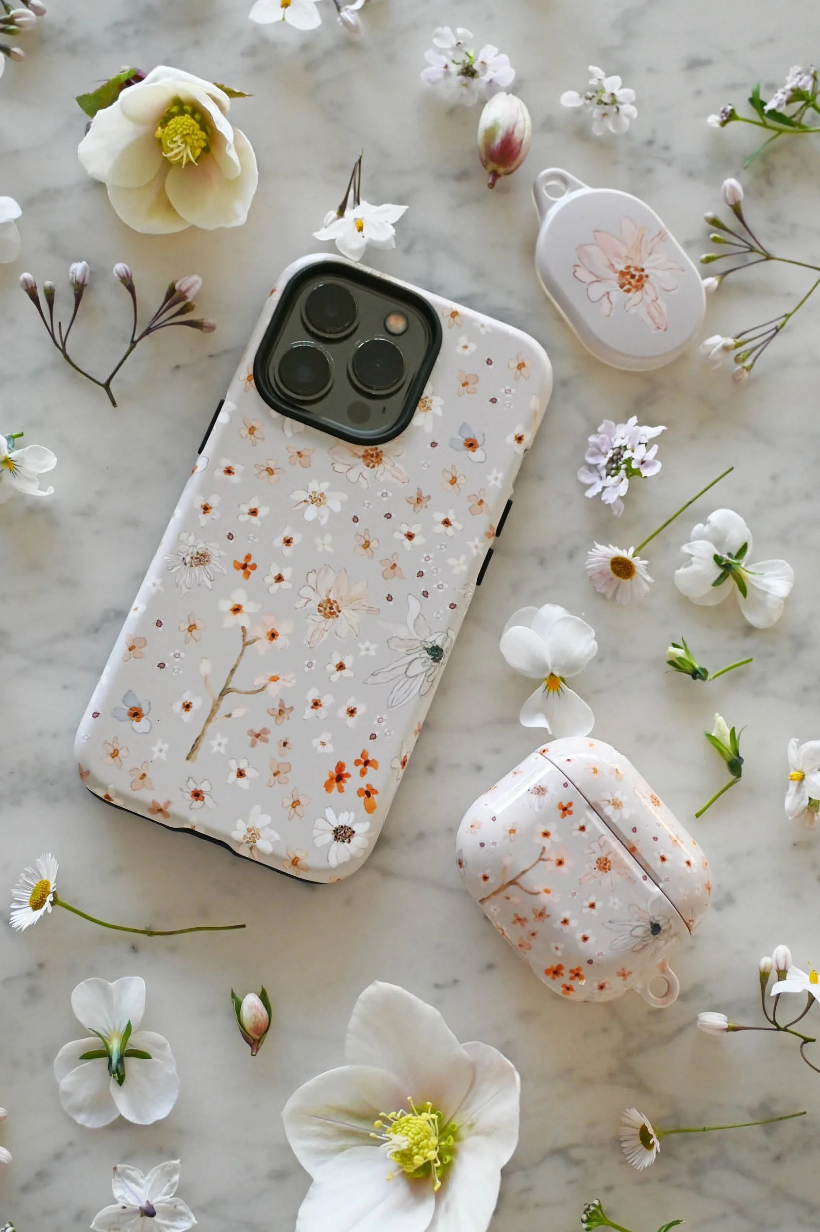 marigold-floral-phone-airpods-airtag-cases-matching-set.jpg