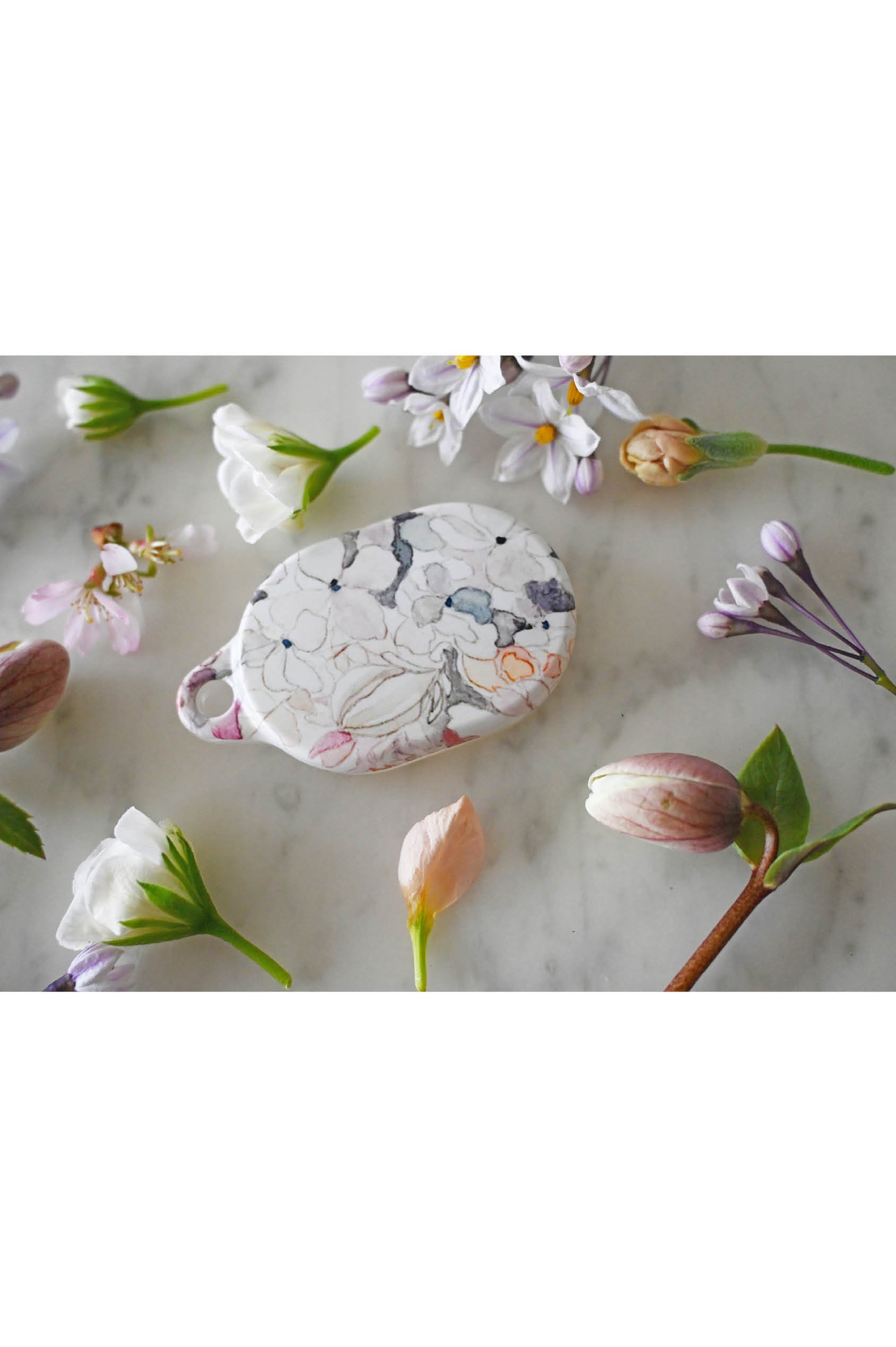 liora-pretty-floral-airtag-case-talia-designs.jpg