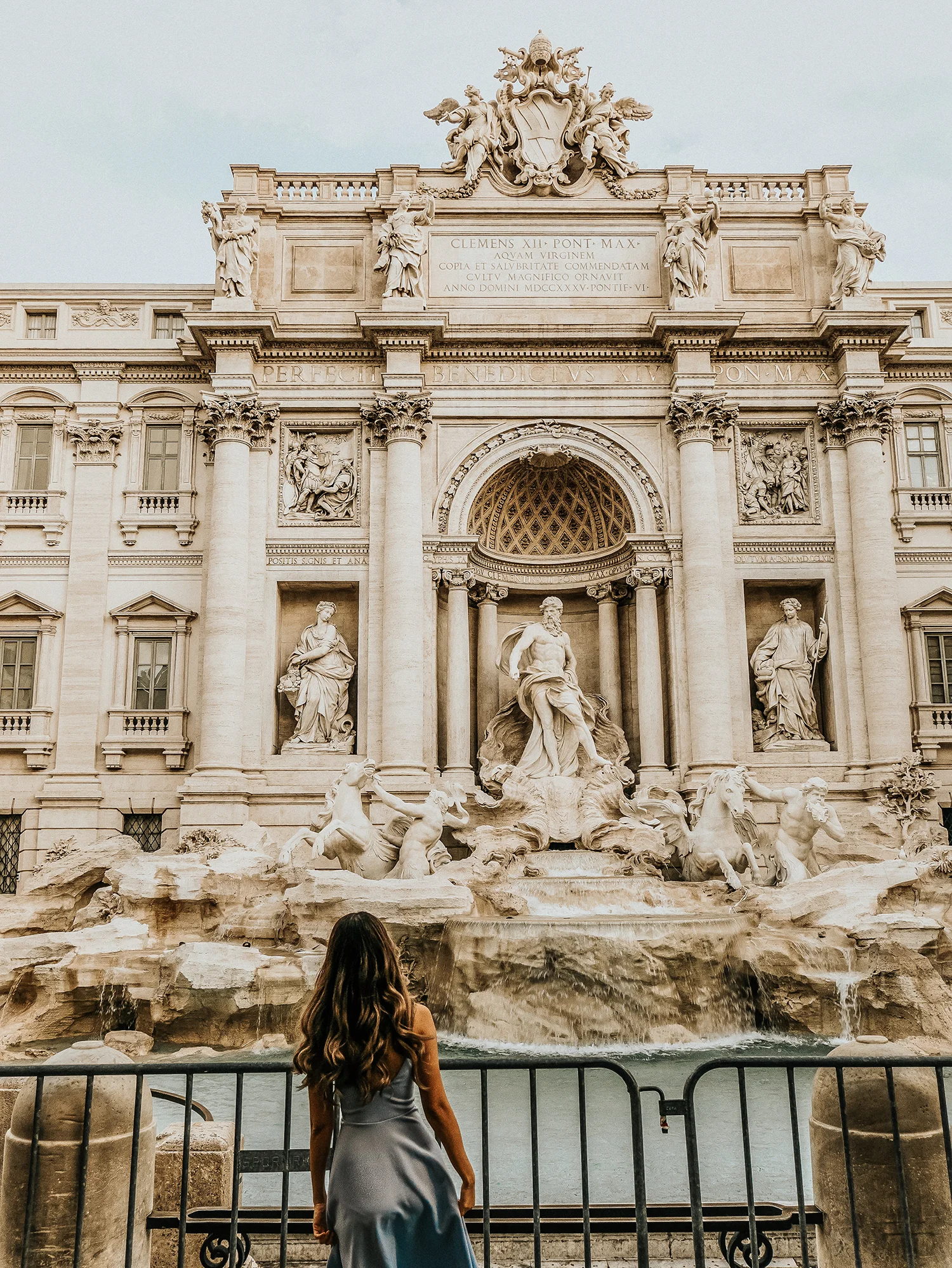 In front of the Trevi Fountain, which is fenced off