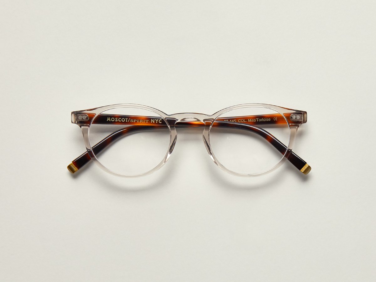 MOSCOT - Frankie Opticals £245 COLOUR Mist/Tortoise SIZE 45 With subtle clean lines, and a full-vue shape, The FRANKIE is the epitome of cool, just like our own Frank, aka, Frankie, who has manned the MOSCOT counter for over 40 years and counting. An iconic frame for an iconic man...and a true MOSCOT character. Handcrafted using Italian acetate featuring unique patterns distinctive to each frame Features two dot rivets Comfortable key hole nose bridge Includes acetate nose pads 3-Barrel hinge MOSCOT temple engravings Signature brass temple tips for MOSCOT SPIRIT frames
